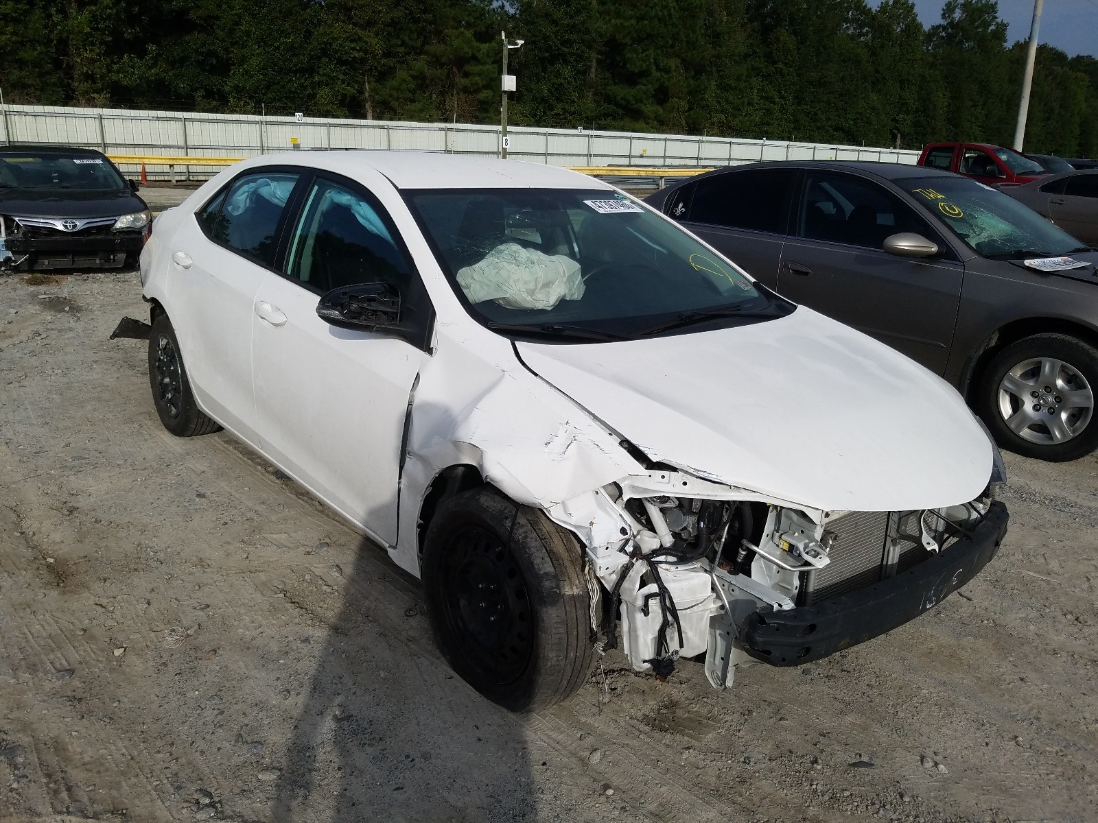 TOYOTA COROLLA L 2015 with VIN 5YFBURHE5FP318714 - Photo from auction