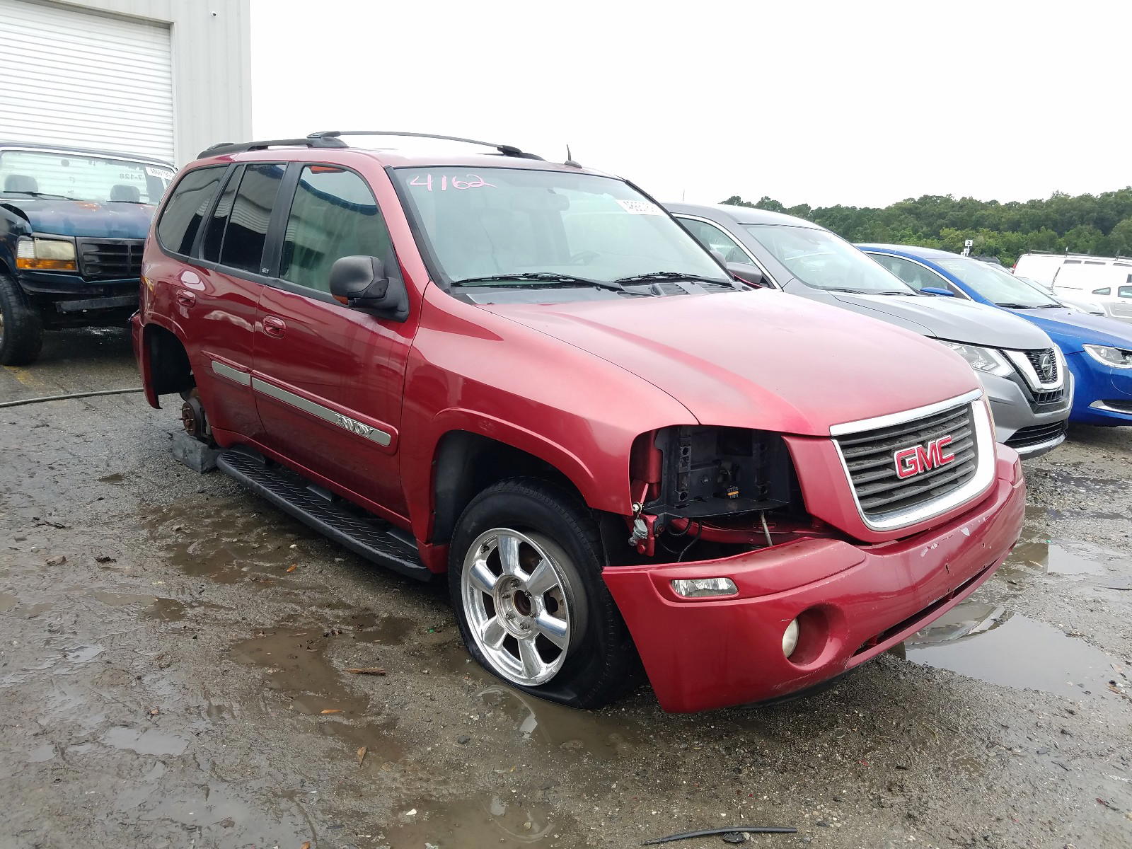 Photo 11 from auction – 2004 GMC ENVOY with VIN 1GKDS13S042424162