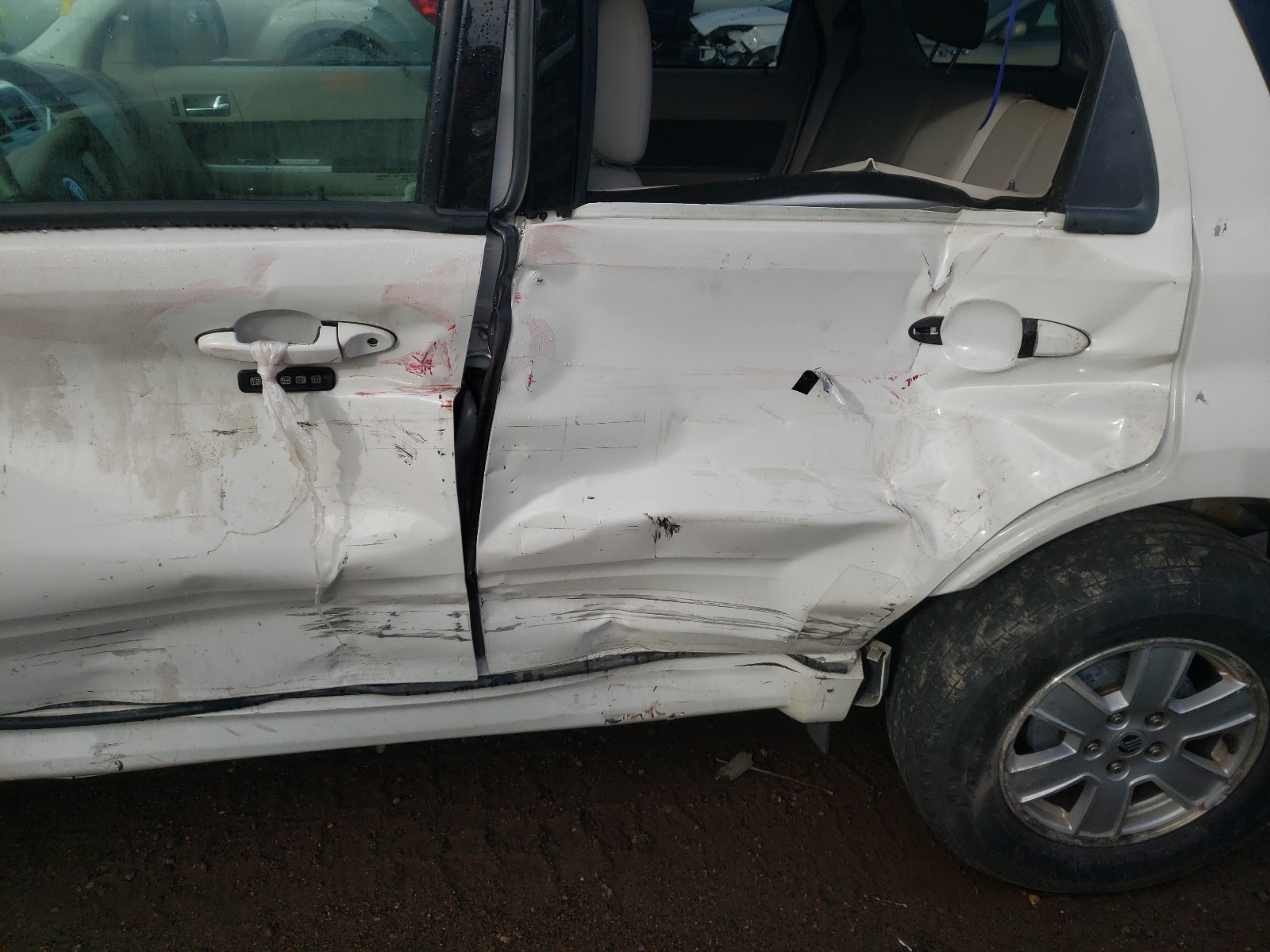 Photo 10 from auction – 2010 MERCURY MARINER with VIN 4M2CN9BG9AKJ17329