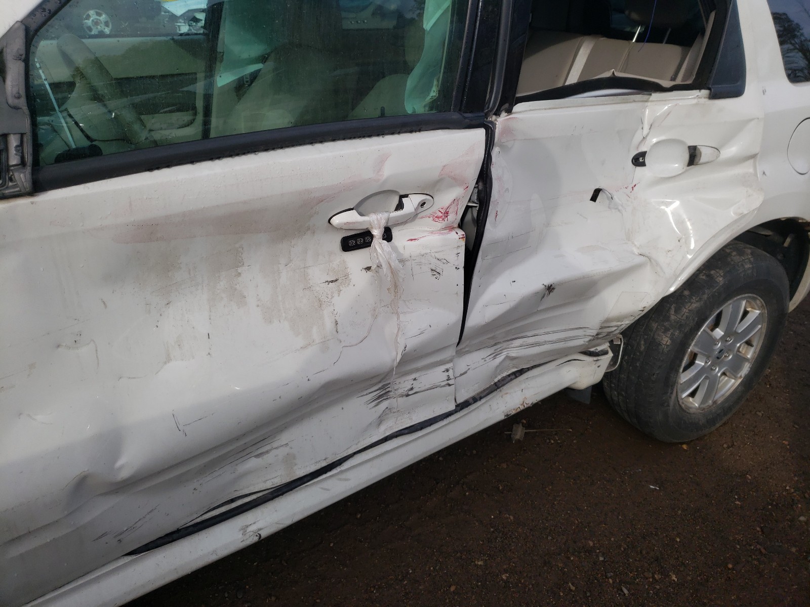 Photo 9 from auction – 2010 MERCURY MARINER with VIN 4M2CN9BG9AKJ17329