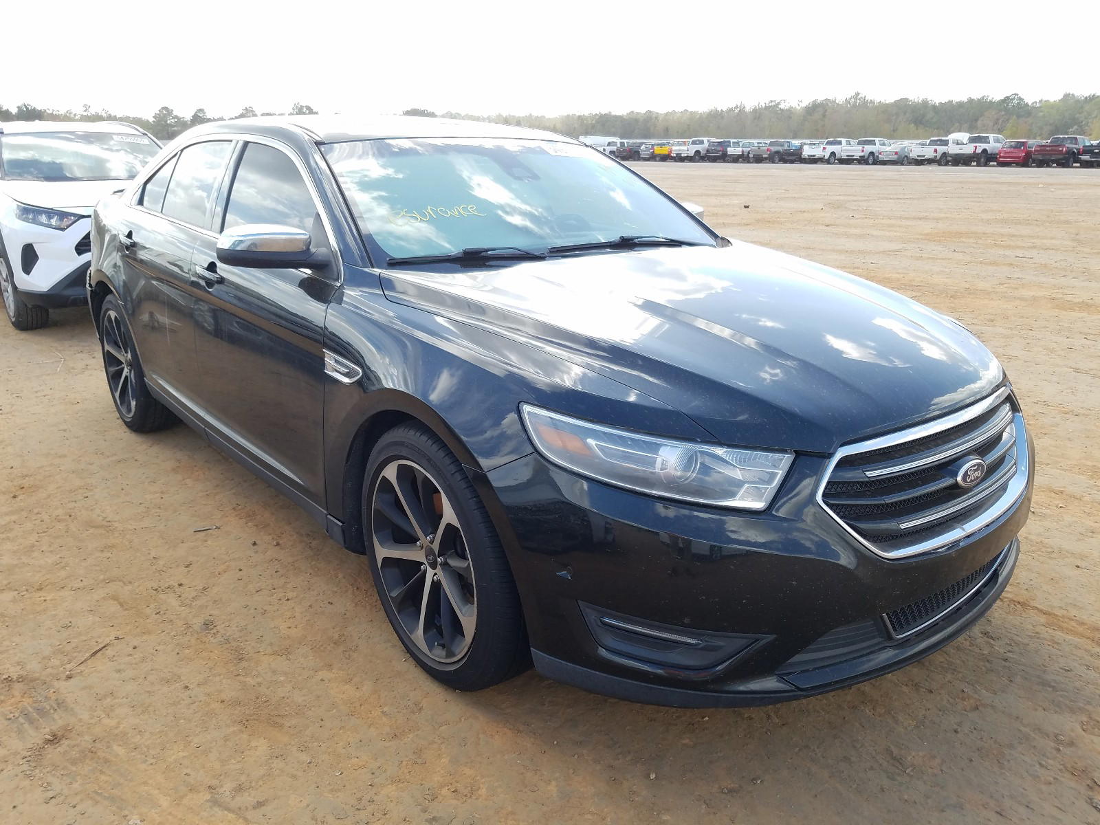FORD TAURUS LIM 2014 with VIN 1FAHP2F8XEG184620 - Photo from auction