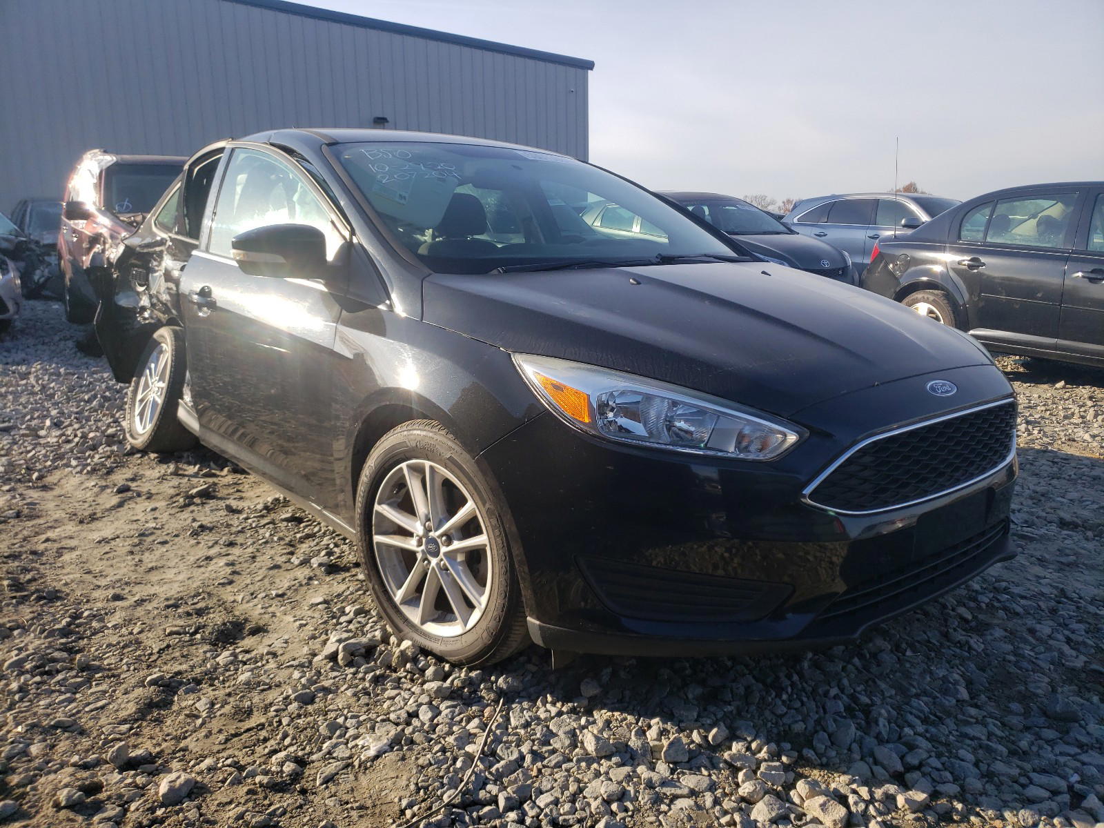 FORD FOCUS SE 2015 with VIN 1FADP3F22FL207204 - Photo from auction