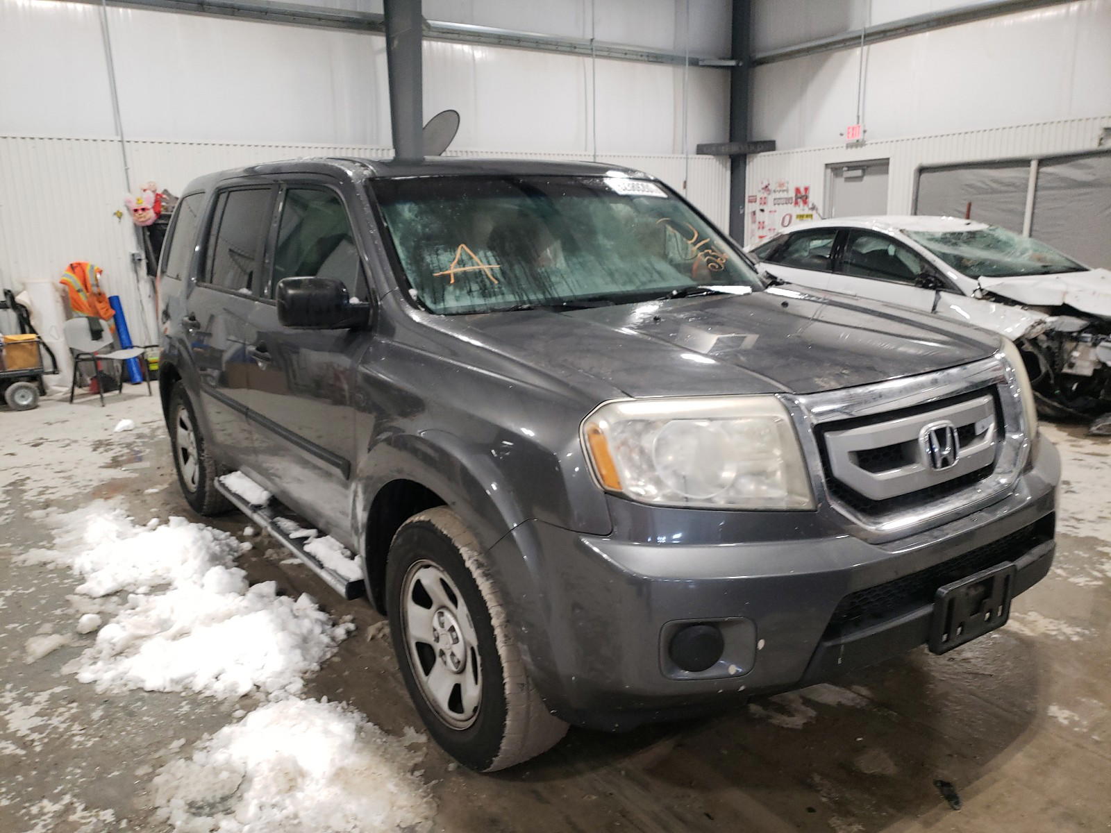 HONDA PILOT LX 2011 with VIN 5FNYF4H29BB055369 - Photo from auction