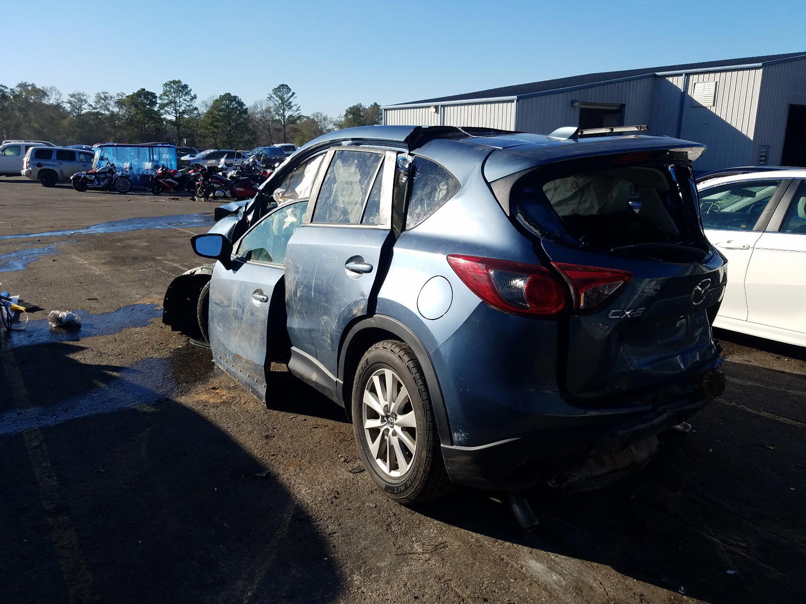 Photo 3 from auction – 2014 MAZDA CX-5 TOURI with VIN JM3KE2CY3E0410068