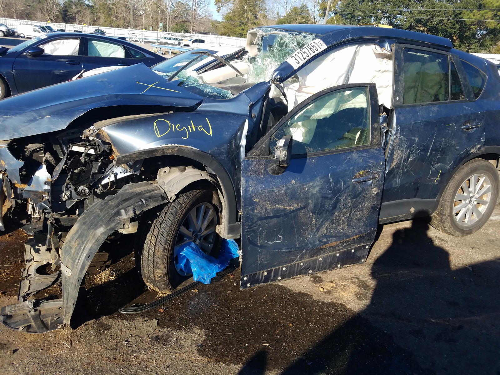 Photo 9 from auction – 2014 MAZDA CX-5 TOURI with VIN JM3KE2CY3E0410068