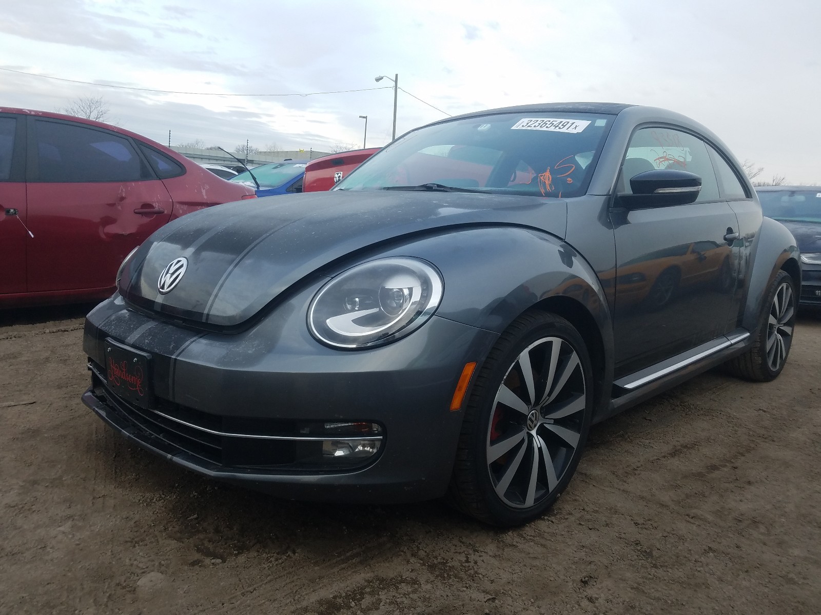 Photo 2 from auction – 2013 VOLKSWAGEN BEETLE TUR with VIN 3VWVA7AT7DM645815