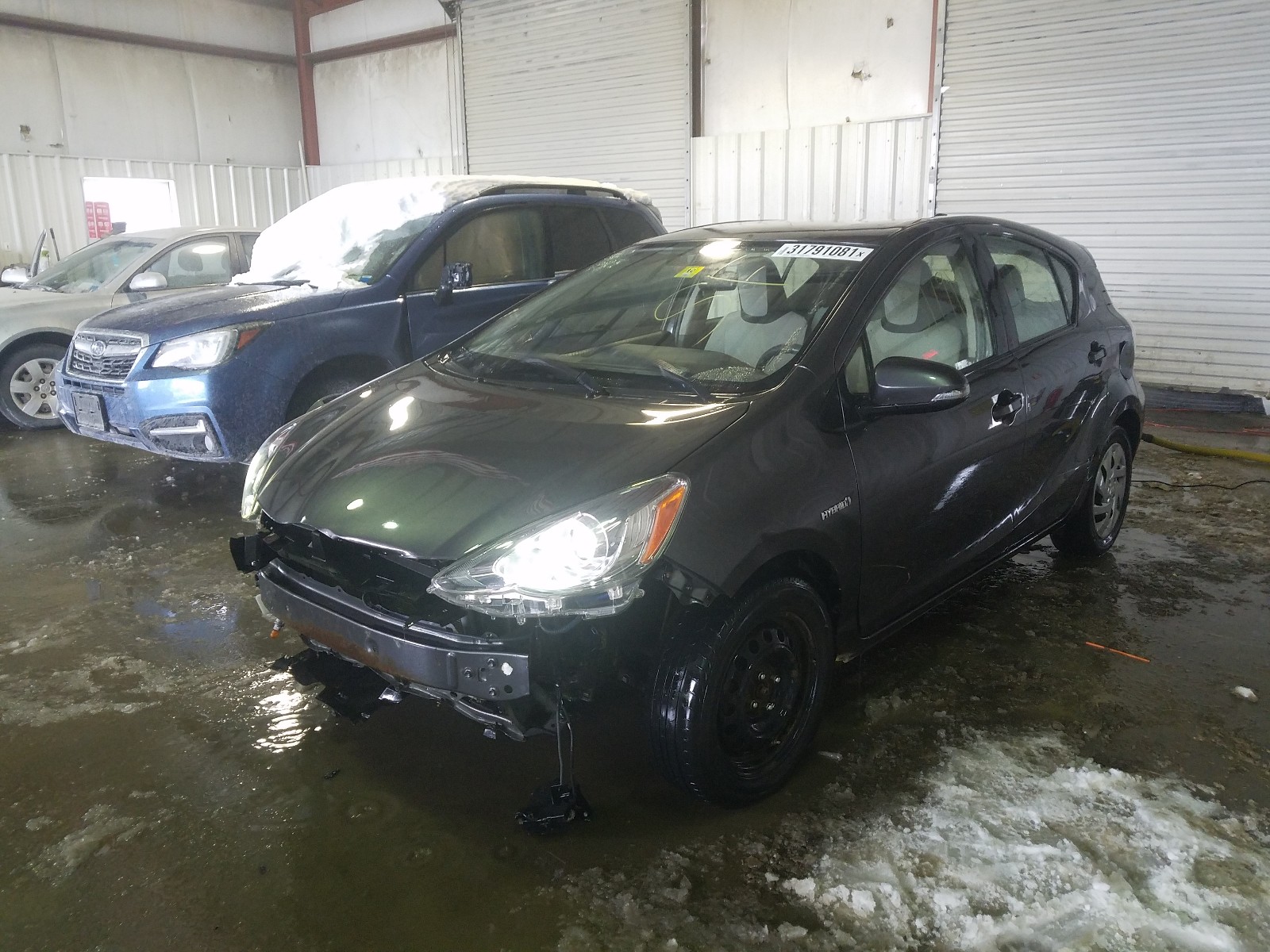 Photo 2 from auction – 2015 TOYOTA PRIUS C with VIN JTDKDTB38F1092922