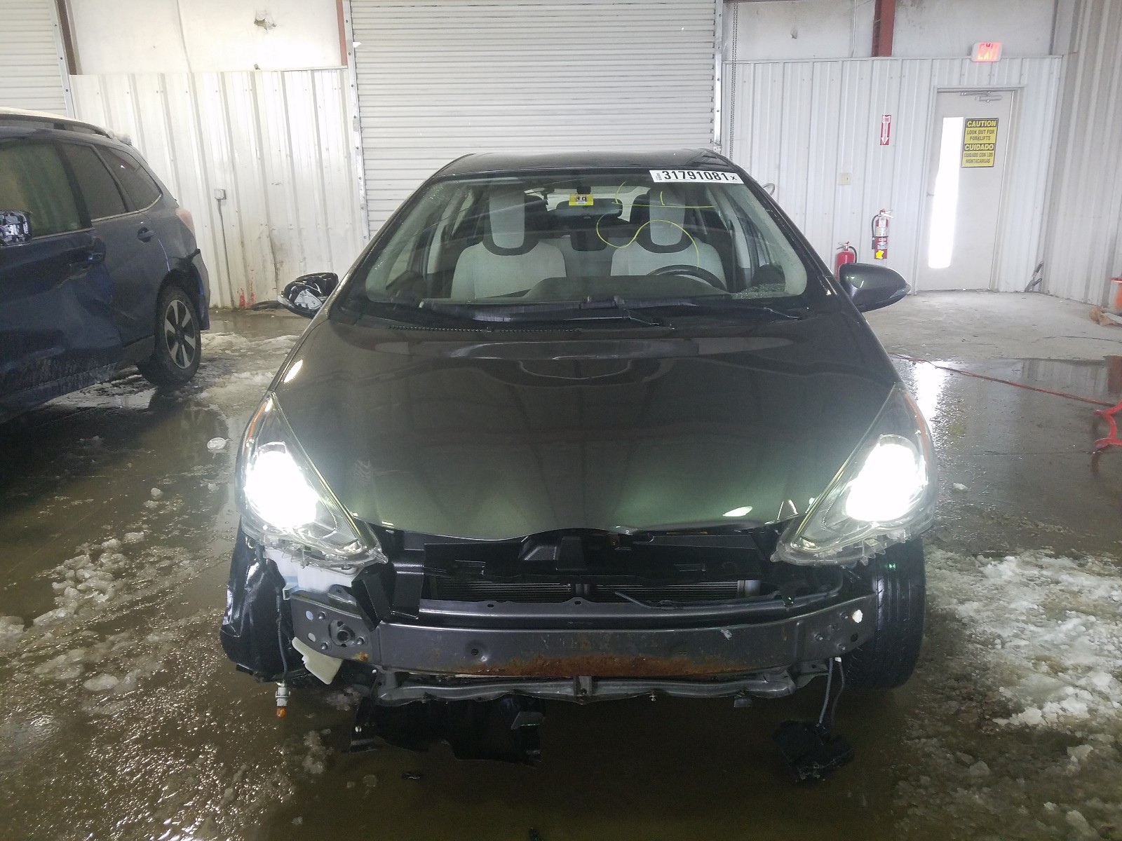 Photo 9 from auction – 2015 TOYOTA PRIUS C with VIN JTDKDTB38F1092922