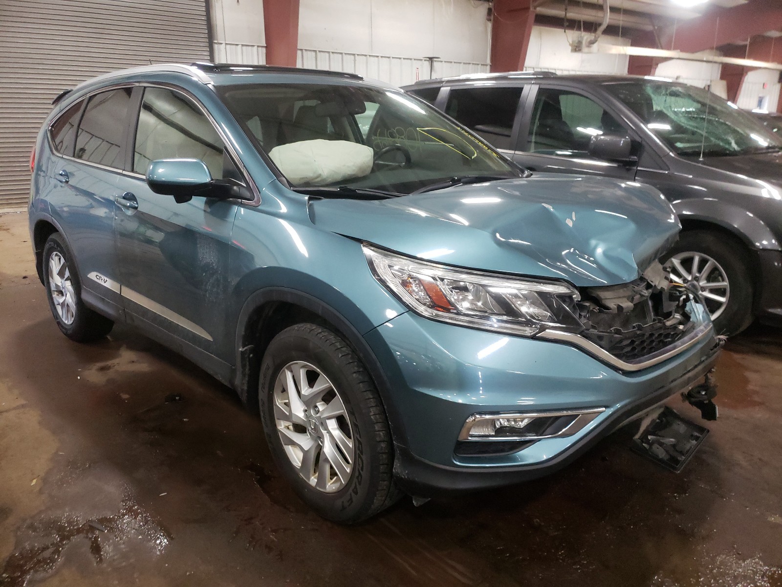 Photo 11 from auction – 2015 HONDA CR-V EXL with VIN 5J6RM4H79FL029261