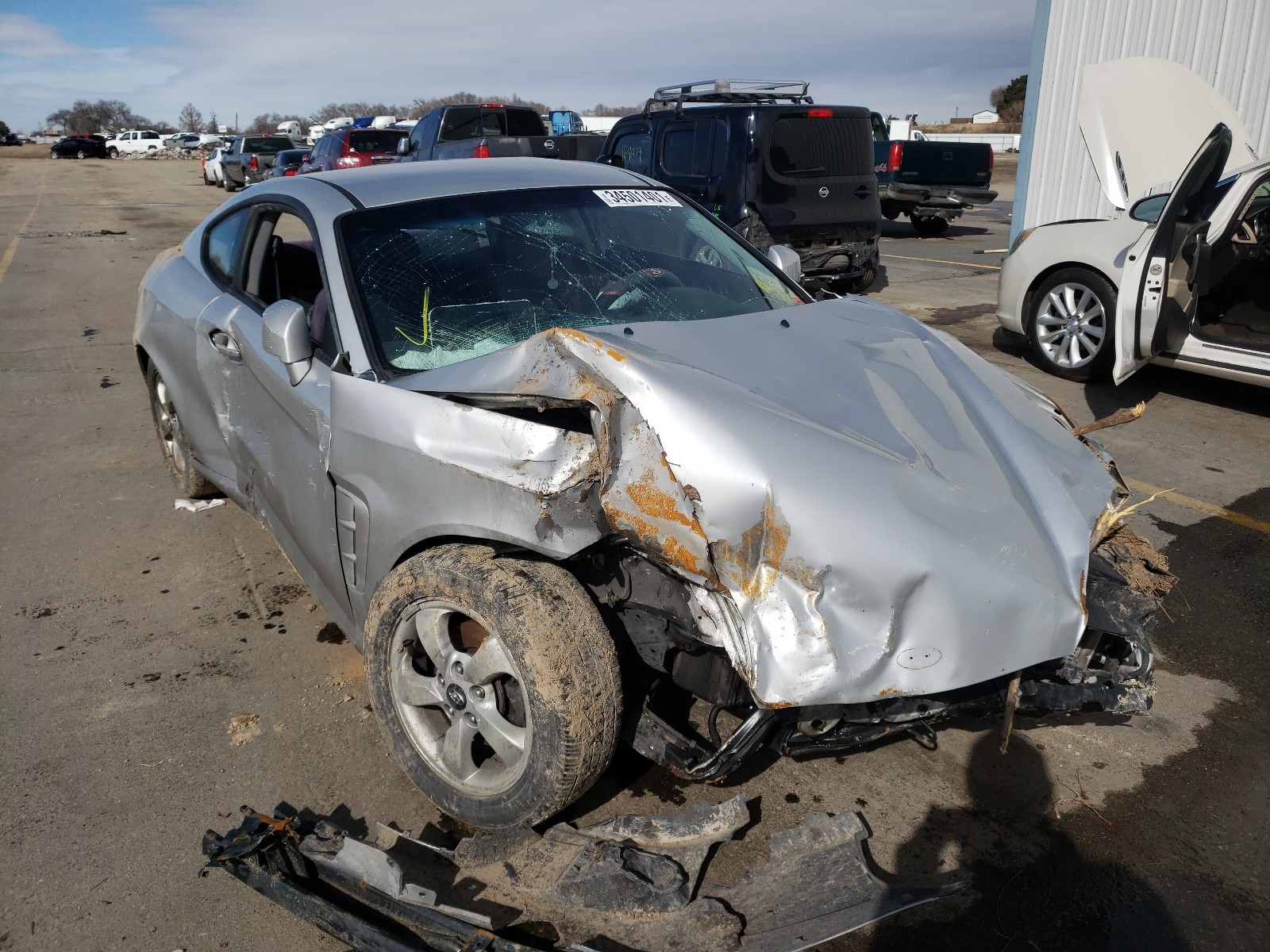 HYUNDAI TIBURON 2005 with VIN KMHHM65D15U166562 - Photo from auction