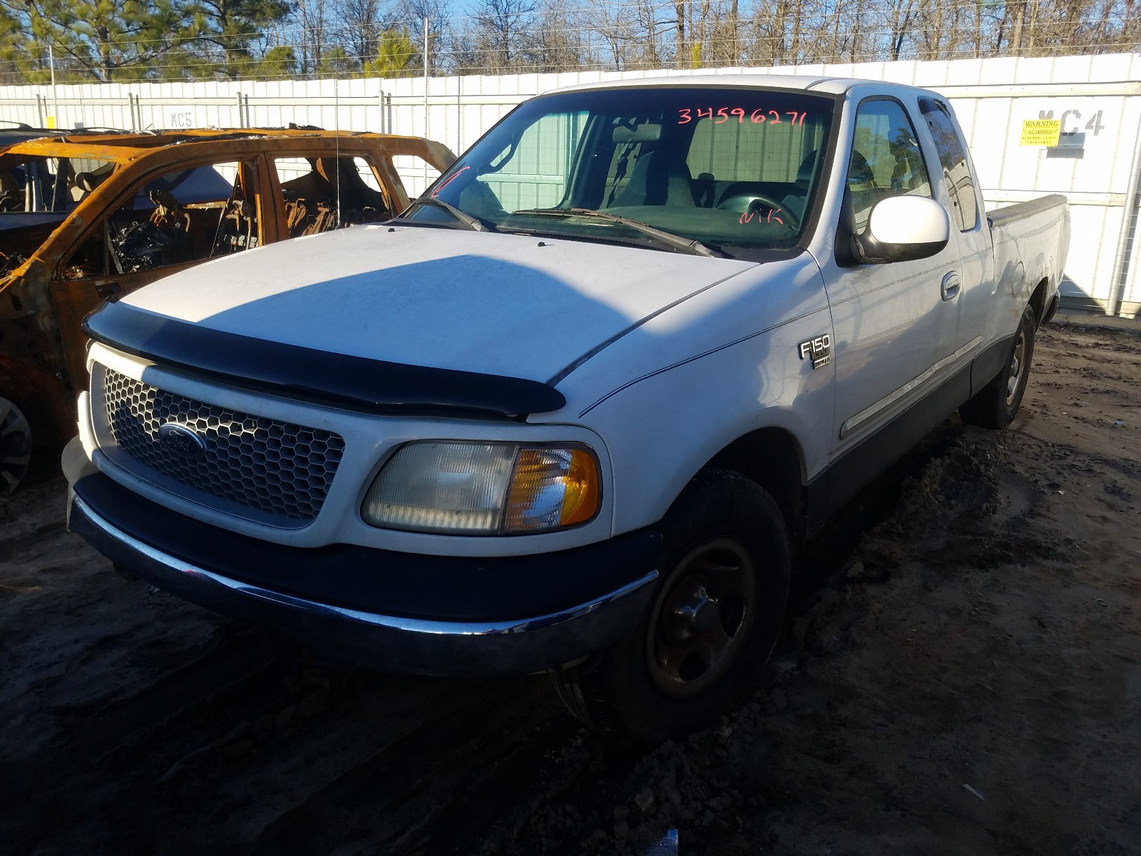 Photo 2 from auction – 1999 FORD F150 with VIN 1FTRX17W9XNB77839