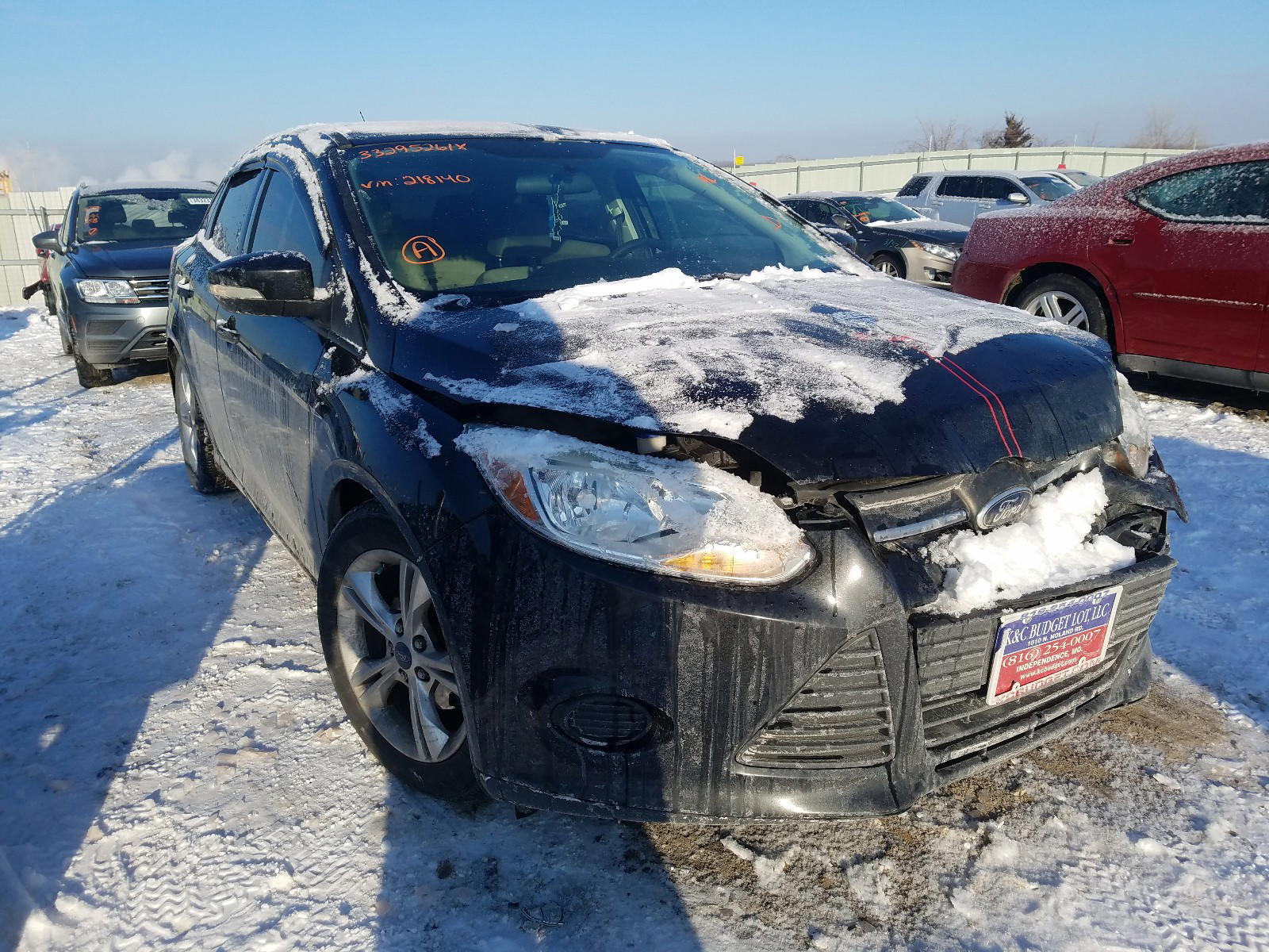 FORD FOCUS SE 2014 with VIN 1FADP3F24EL218140 - Photo from auction