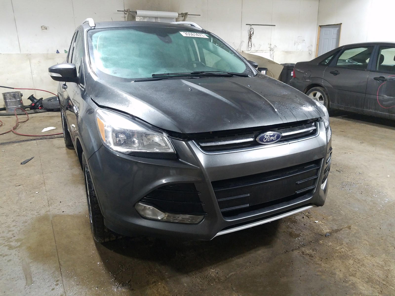 FORD ESCAPE TIT 2016 with VIN 1FMCU9JX5GUA96823 - Photo from auction
