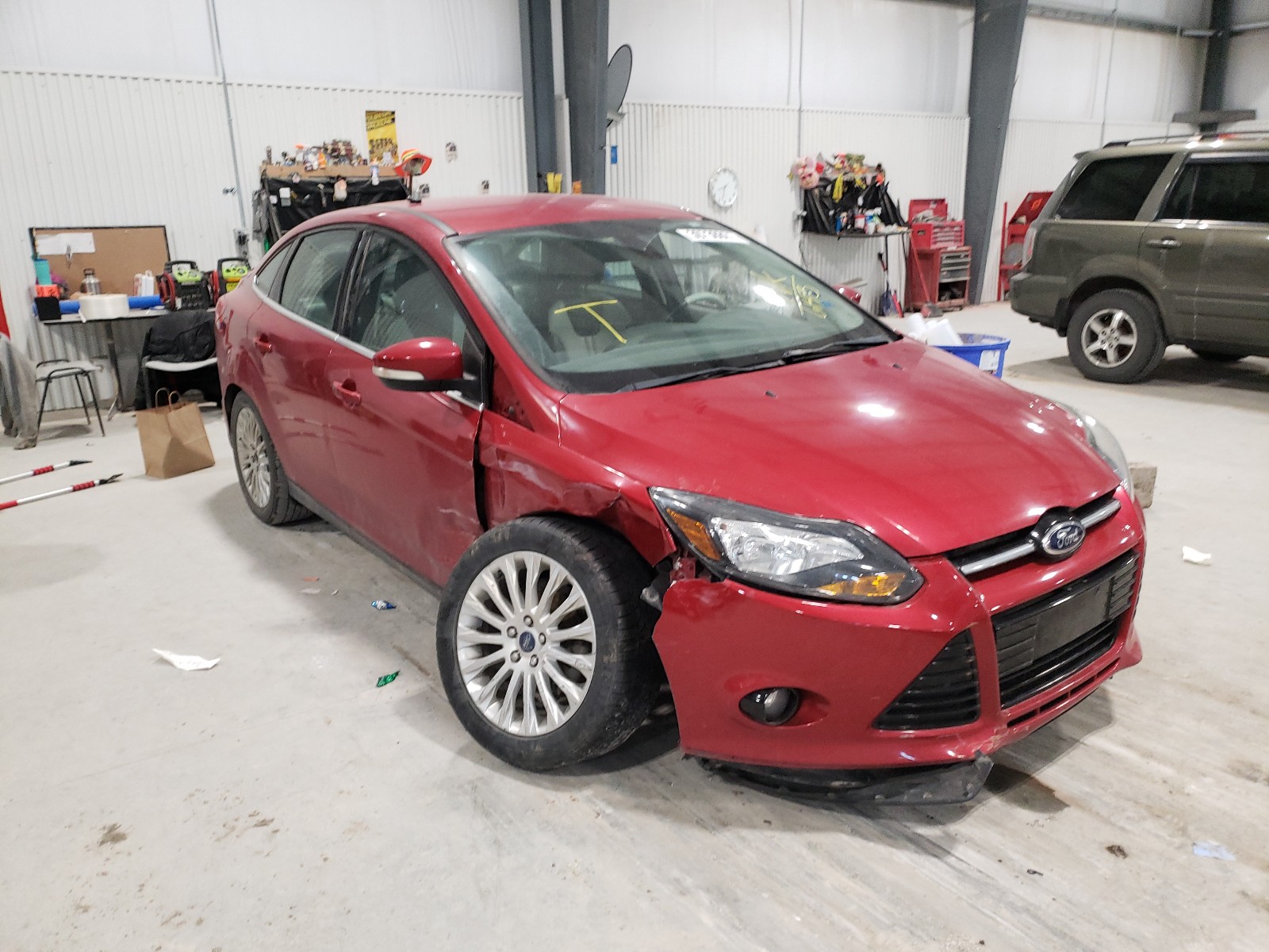 FORD FOCUS TITA 2012 with VIN 1FAHP3J28CL386143 - Photo from auction