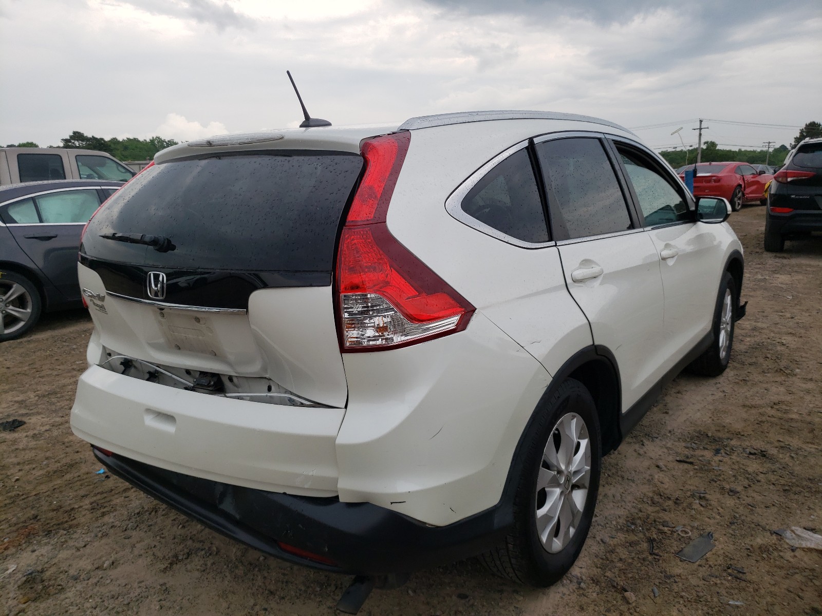 Photo 4 from auction – 2014 HONDA CR-V EXL with VIN 5J6RM3H79EL025929