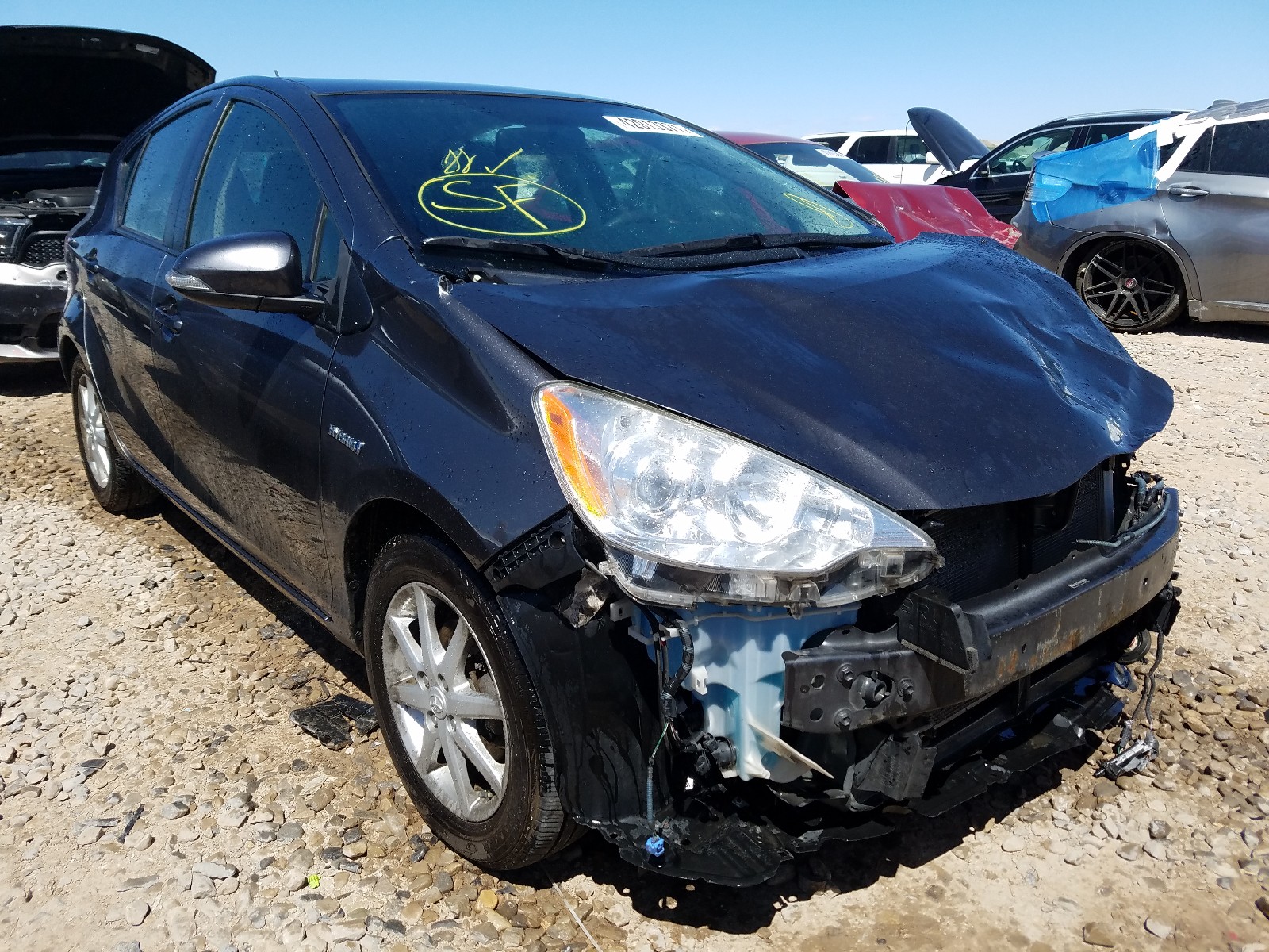 TOYOTA PRIUS C 2013 with VIN JTDKDTB38D1044964 - Photo from auction