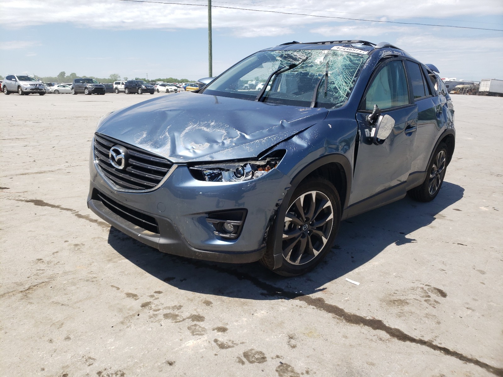 Photo 2 from auction – 2016 MAZDA CX-5 GT with VIN JM3KE2DY7G0693527
