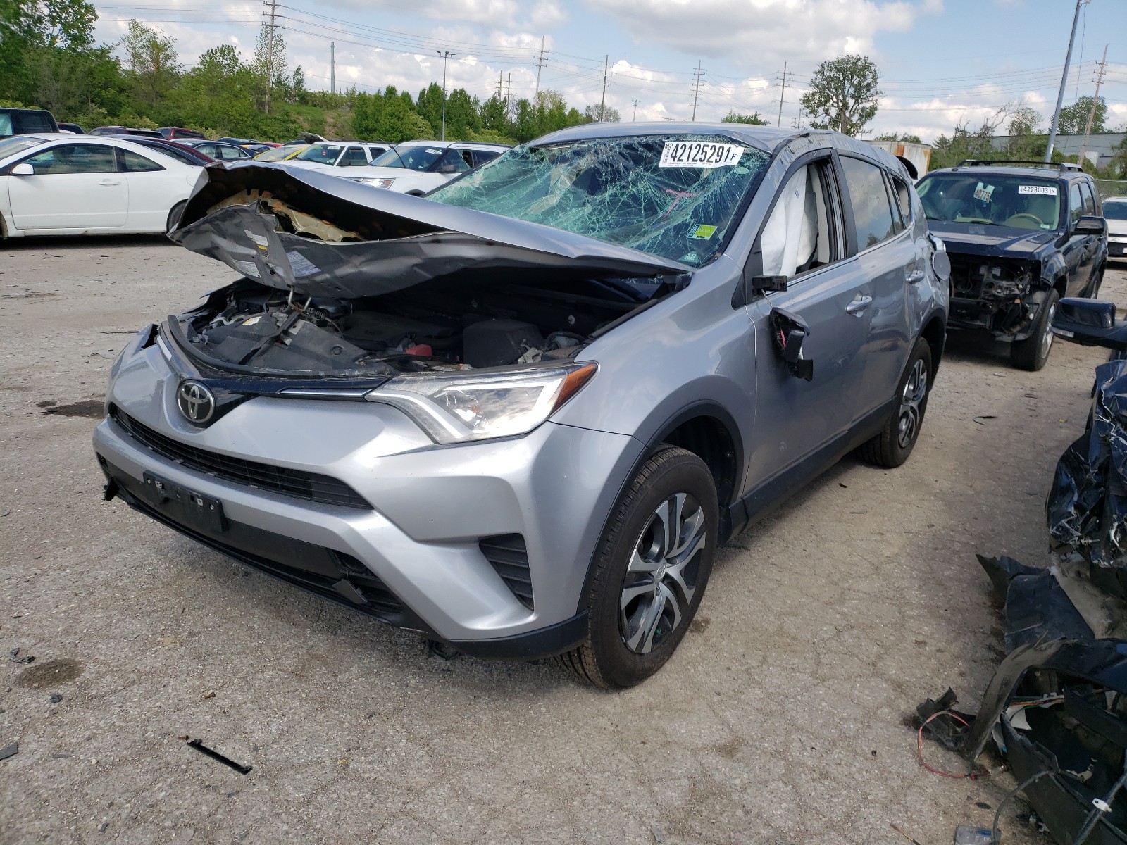 Photo 2 from auction – 2017 TOYOTA RAV4 LE with VIN 2T3BFREVXHW670923
