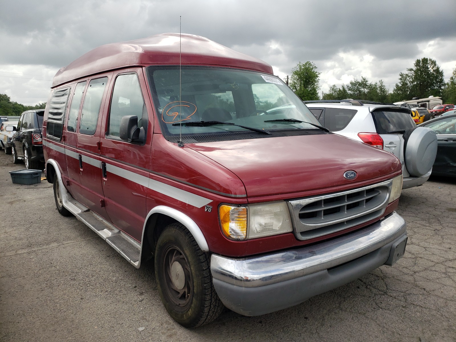 FORD ECONOLINE 1999 with VIN 1FDRE14W1XHA75536 - Photo from auction