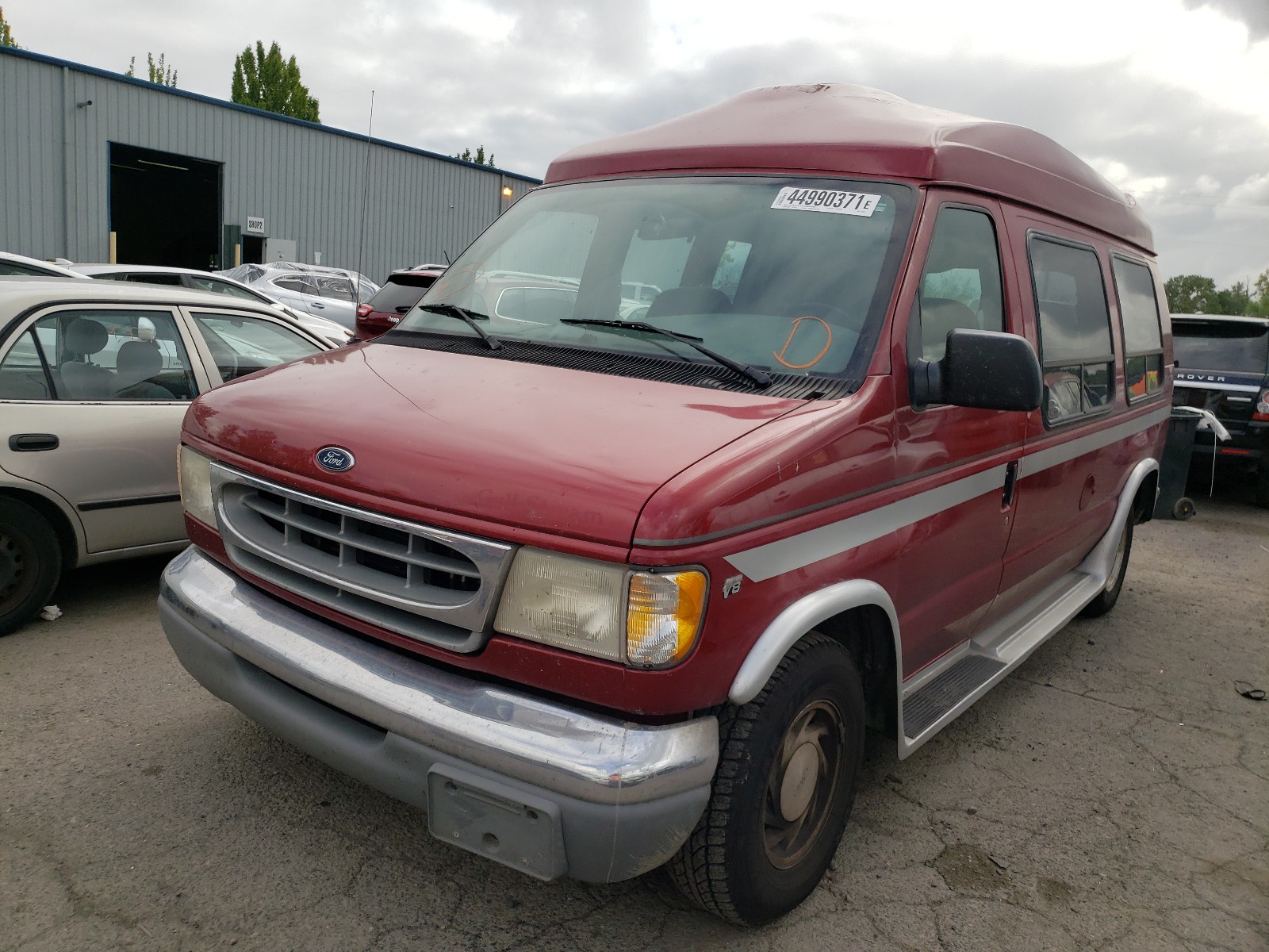 Photo 2 from auction – 1999 FORD ECONOLINE with VIN 1FDRE14W1XHA75536