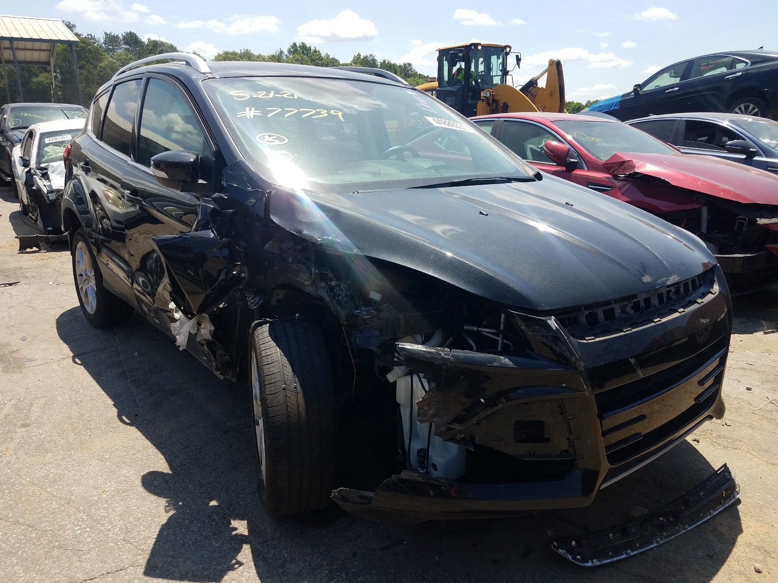FORD ESCAPE TIT 2015 with VIN 1FMCU0JX9FUC77739 - Photo from auction