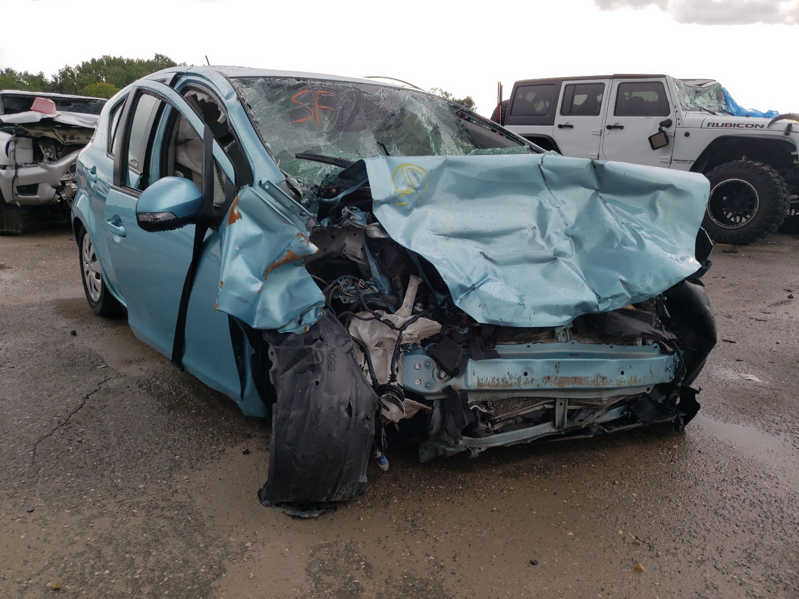 TOYOTA PRIUS C 2013 with VIN JTDKDTB33D1038005 - Photo from auction