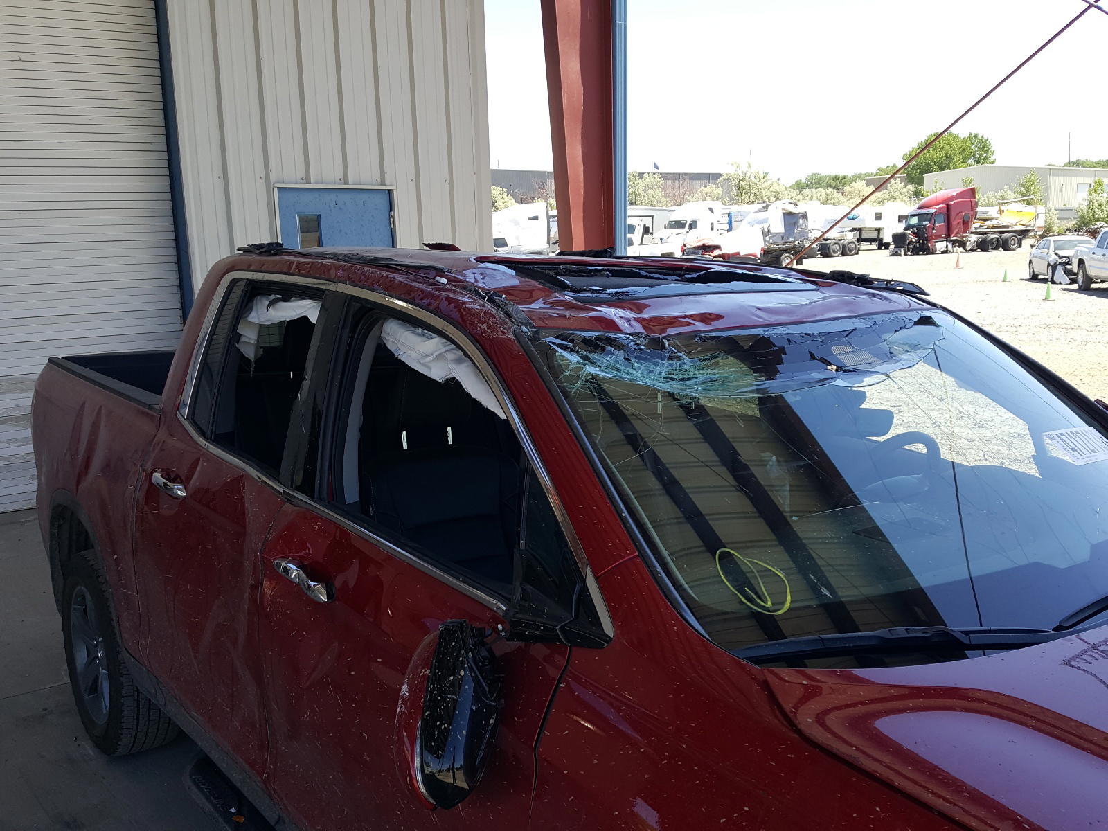 Photo 9 from auction – 2021 HONDA RIDGELINE with VIN 5FPYK3F74MB011147