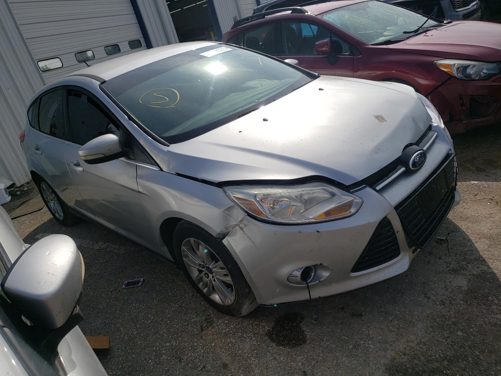 FORD FOCUS SEL 2012 with VIN 1FAHP3M20CL358249 - Photo from auction