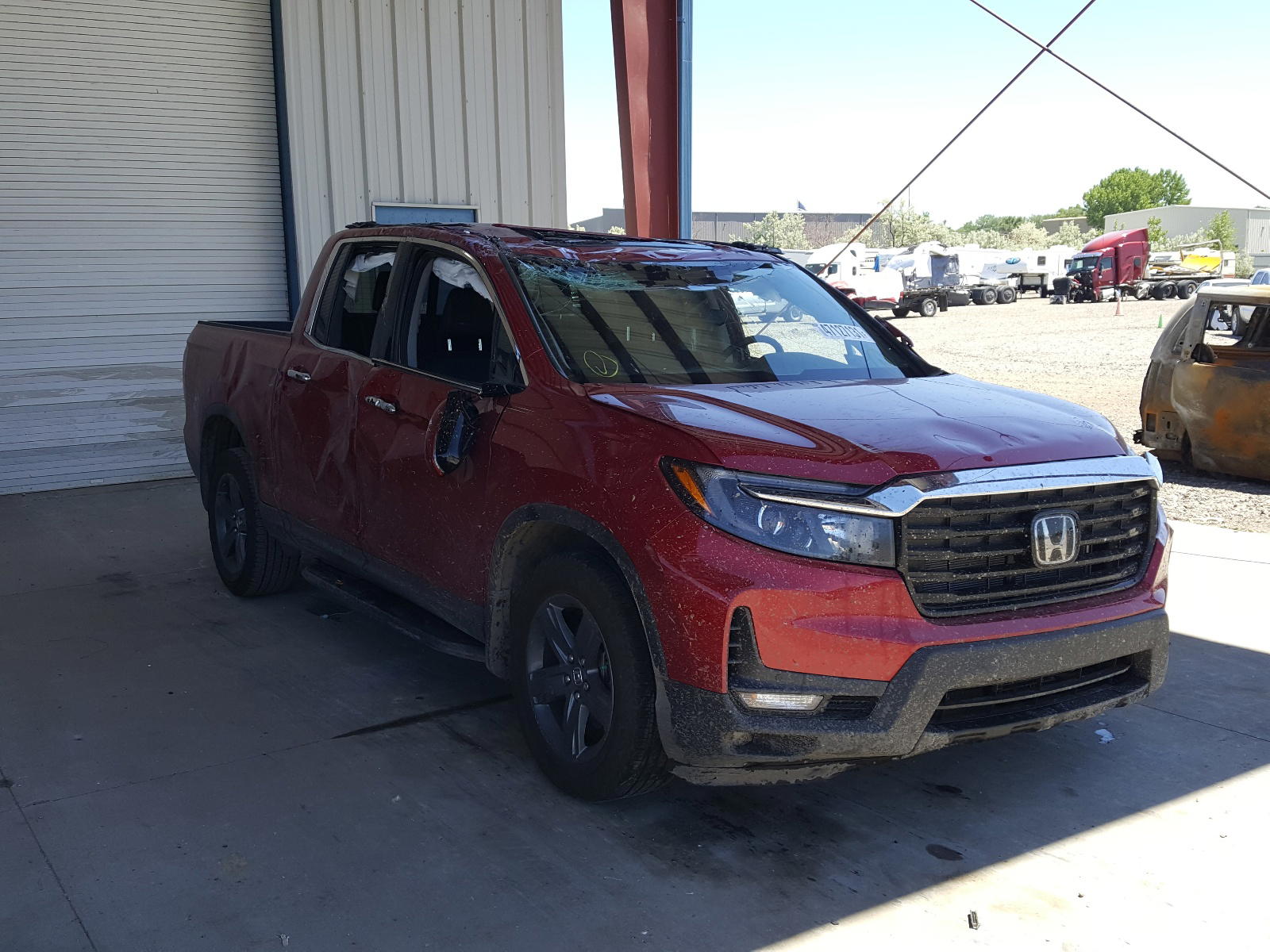 HONDA RIDGELINE 2021 with VIN 5FPYK3F74MB011147 - Photo from auction