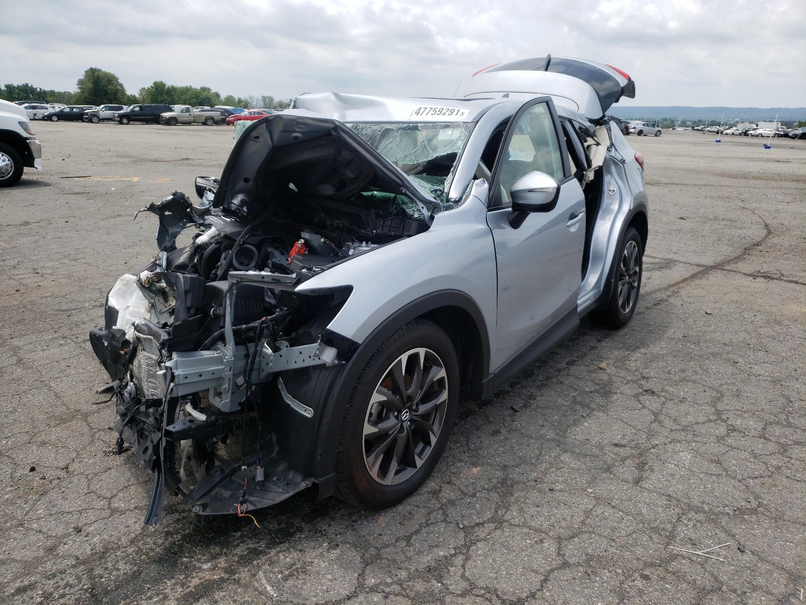 Photo 2 from auction – 2016 MAZDA CX-5 GT with VIN JM3KE4DYXG0642731