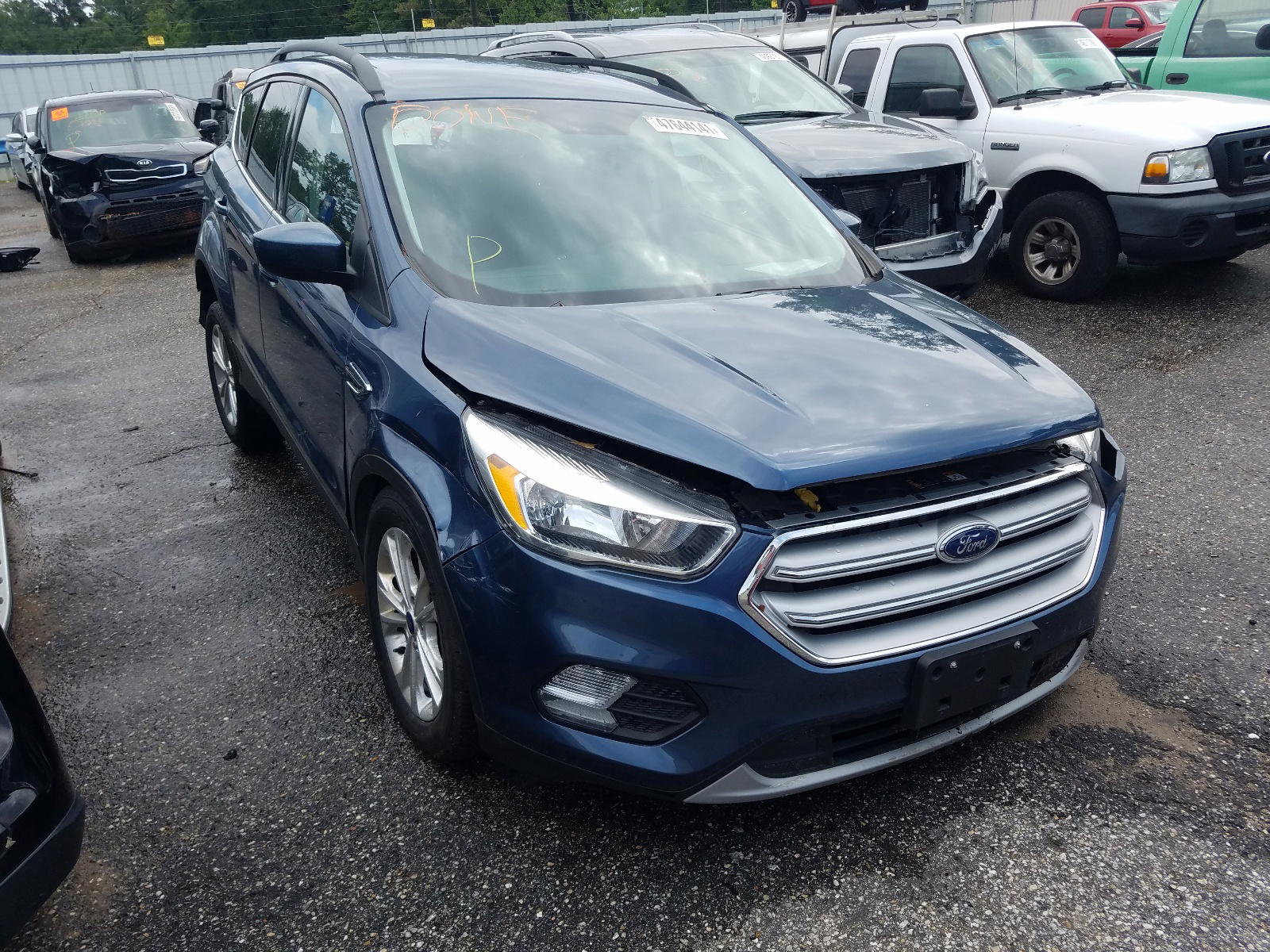 FORD ESCAPE SE 2018 with VIN 1FMCU9GD3JUB12943 - Photo from auction