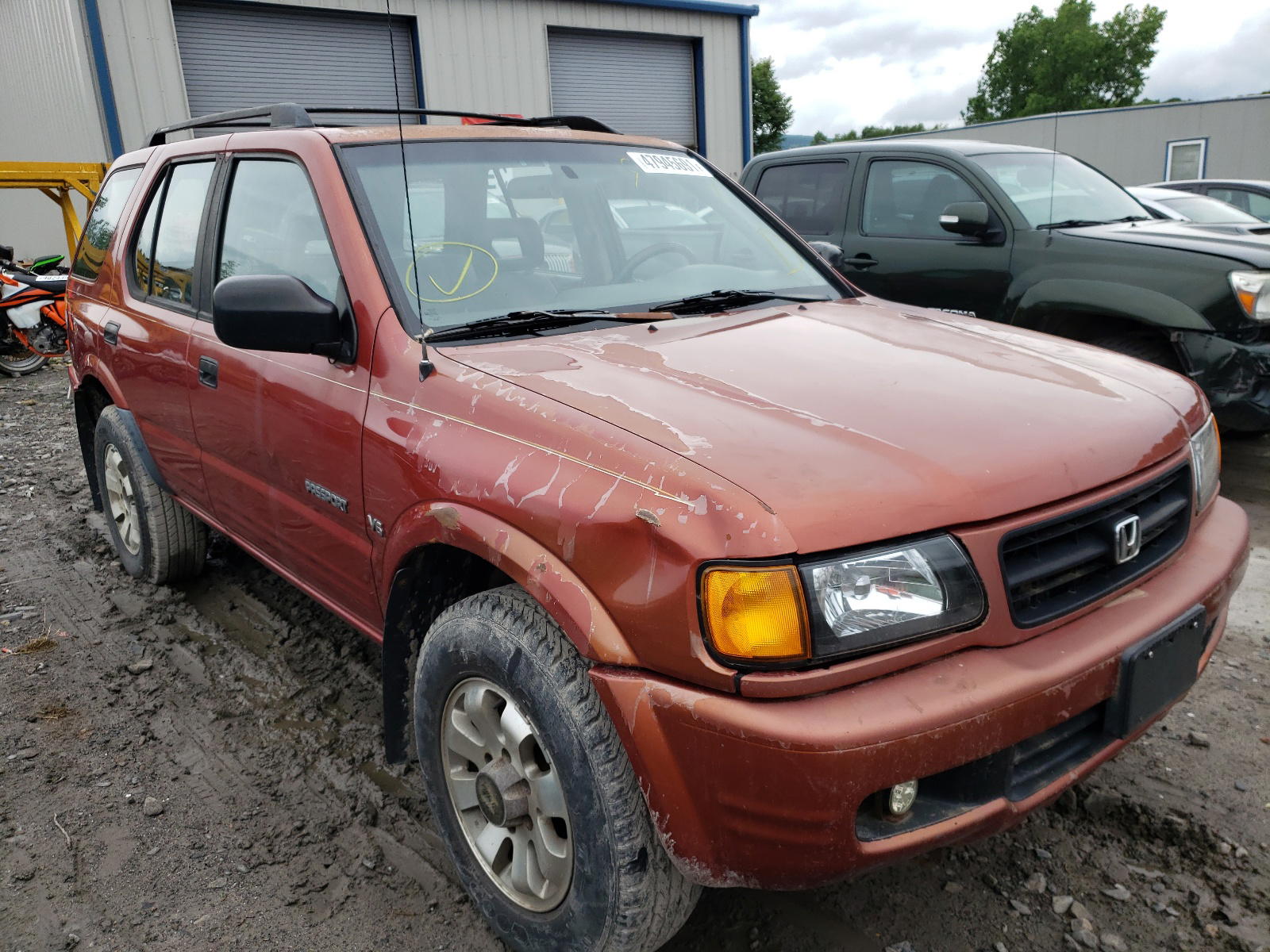 HONDA PASSPORT E 1999 with VIN 4S6CM58W2X4411753 - Photo from auction