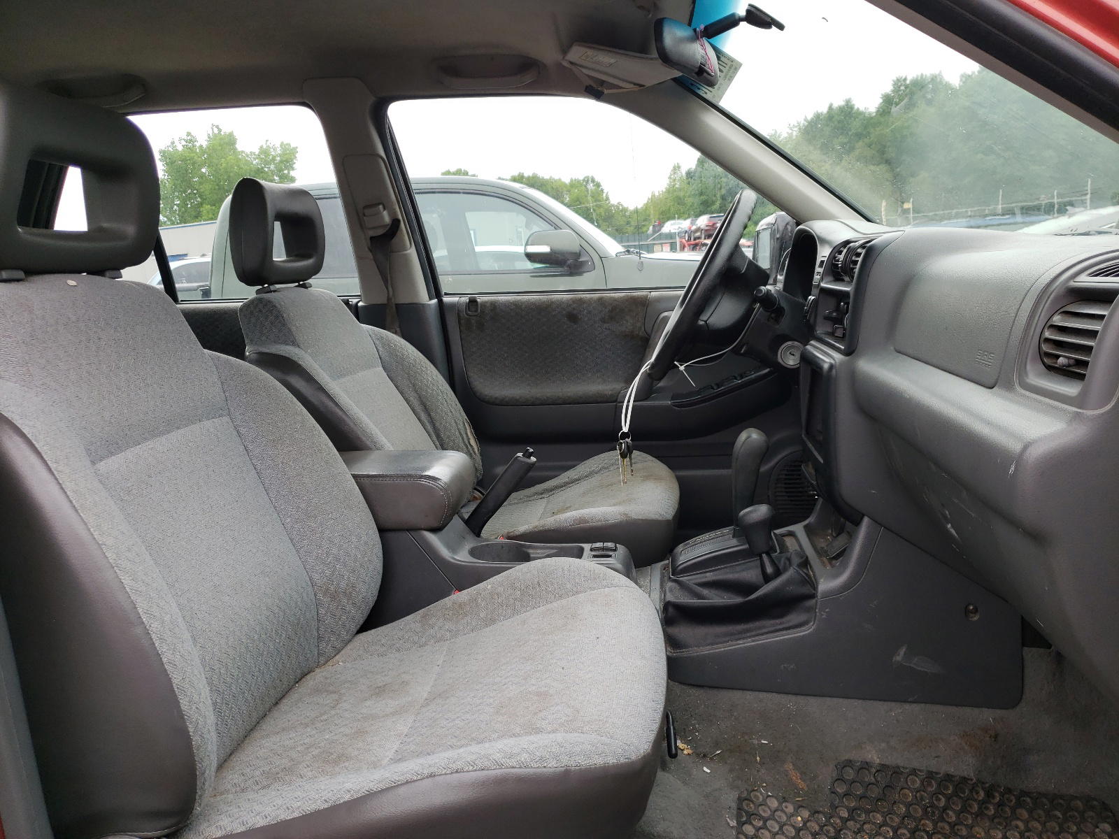 Photo 5 from auction – 1999 HONDA PASSPORT E with VIN 4S6CM58W2X4411753