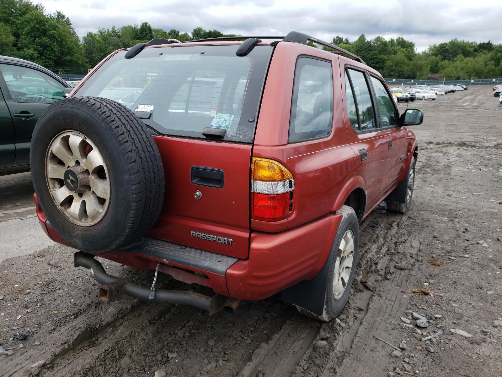 Photo 4 from auction – 1999 HONDA PASSPORT E with VIN 4S6CM58W2X4411753