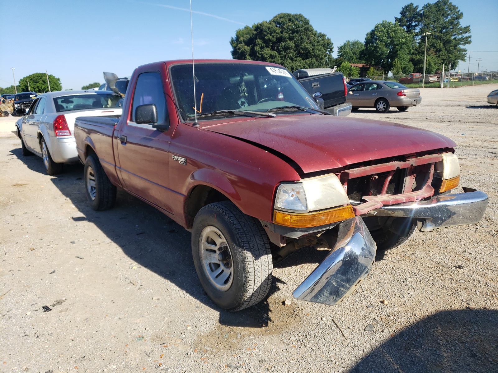 FORD RANGER 1999 with VIN 1FTYR10CXXPB86401 - Photo from auction