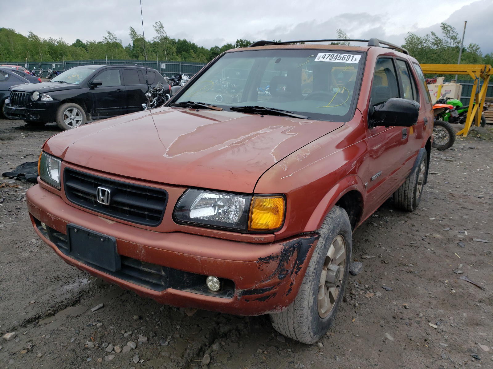 Photo 2 from auction – 1999 HONDA PASSPORT E with VIN 4S6CM58W2X4411753