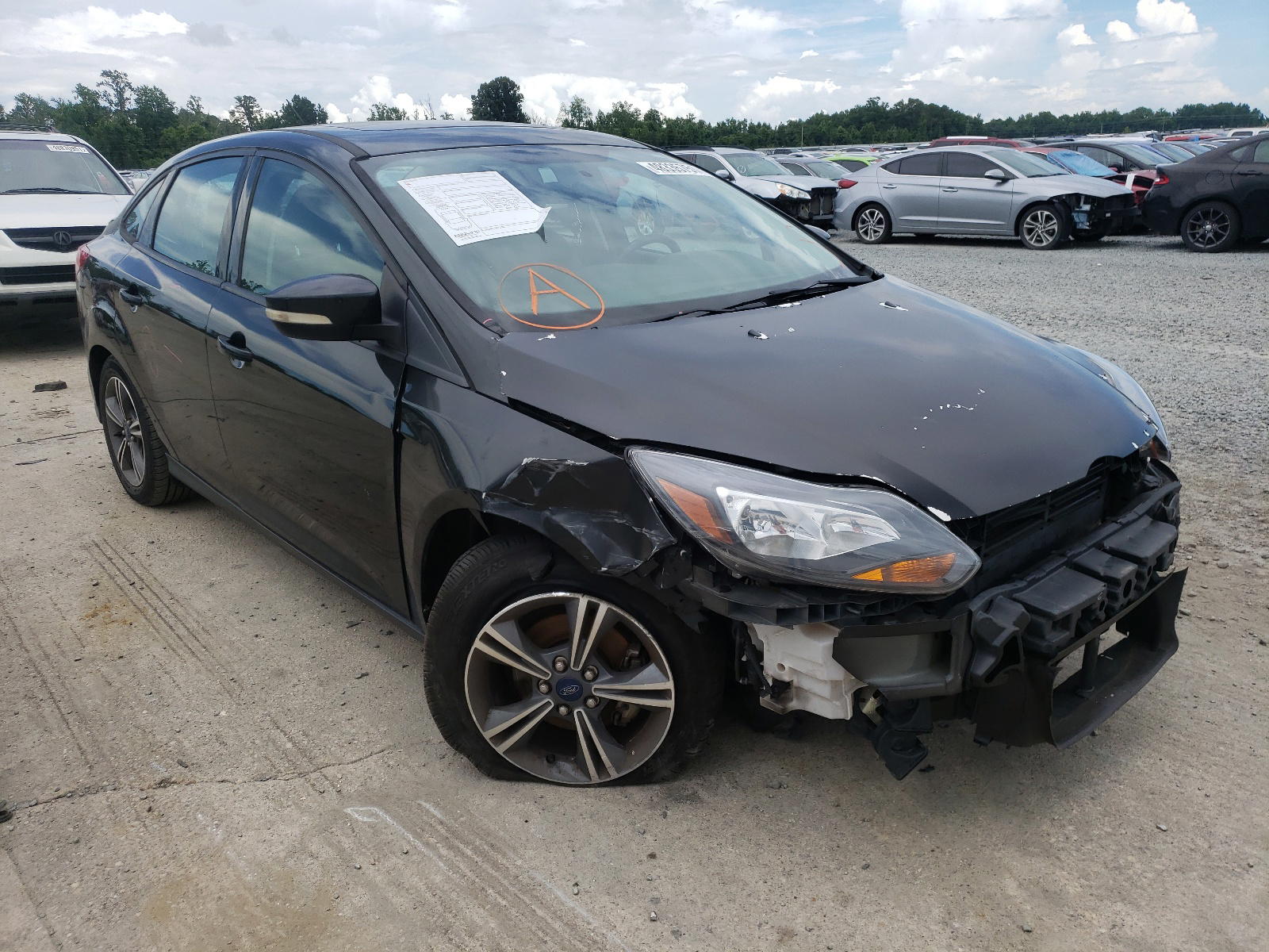 FORD FOCUS SE 2014 with VIN 1FADP3F25EL353384 - Photo from auction
