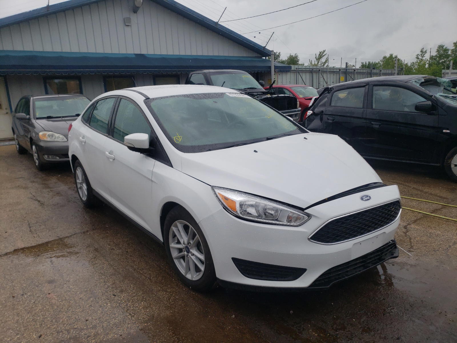 FORD FOCUS SE 2017 with VIN 1FADP3F23HL268855 - Photo from auction