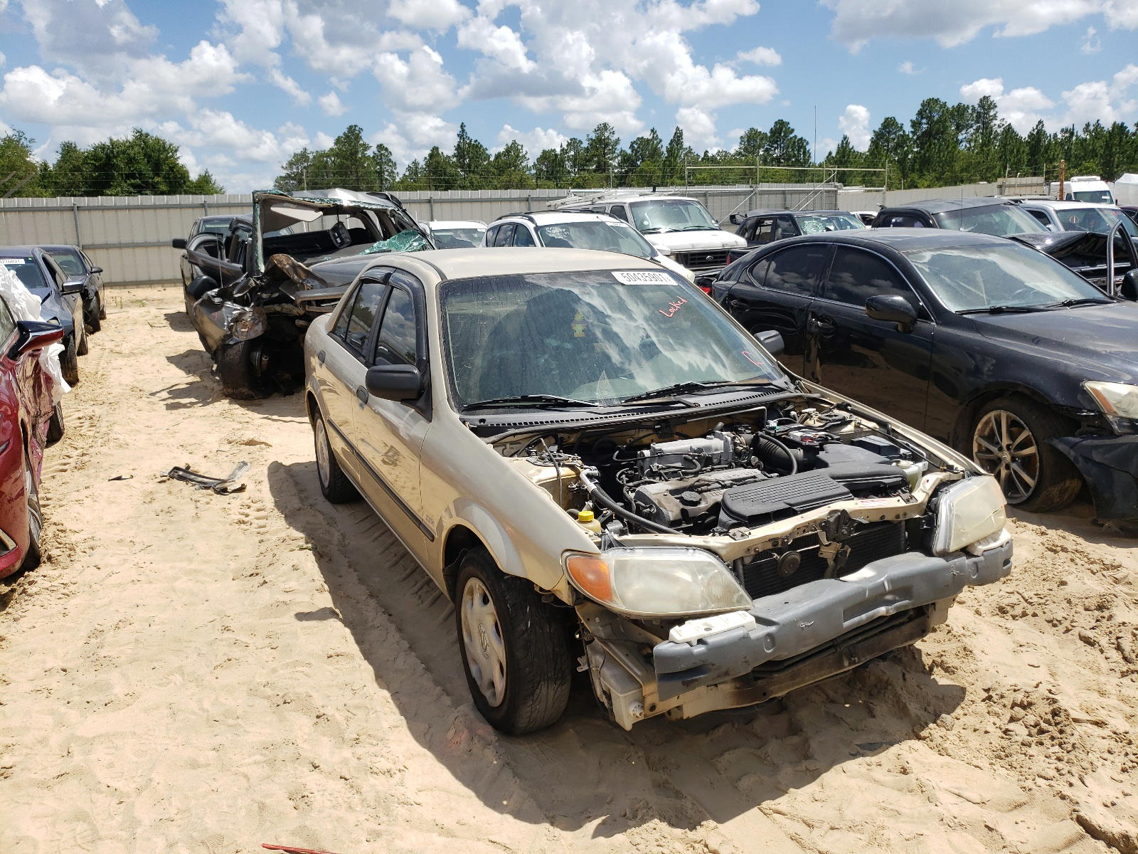 MAZDA PROTEGE DX 2001 with VIN JM1BJ222410410544 - Photo from auction