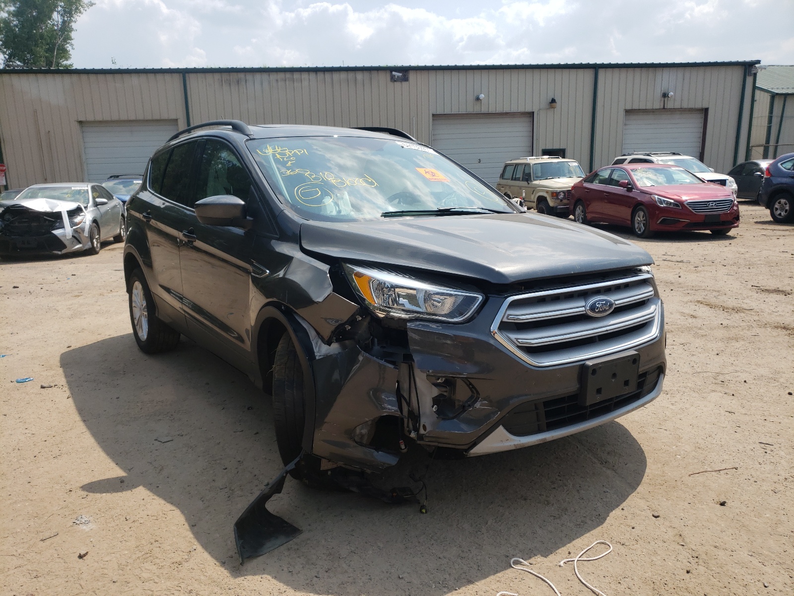 FORD ESCAPE SE 2018 with VIN 1FMCU9GD1JUA66061 - Photo from auction
