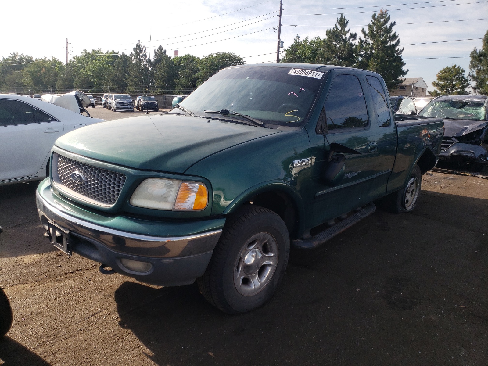 Photo 2 from auction – 1999 FORD F150 with VIN 1FTRX18LXXNA87751