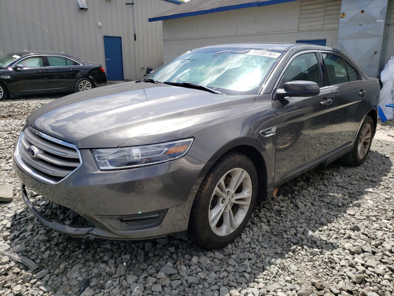 Photo 2 from auction – 2015 FORD TAURUS SEL with VIN 1FAHP2E83FG160890