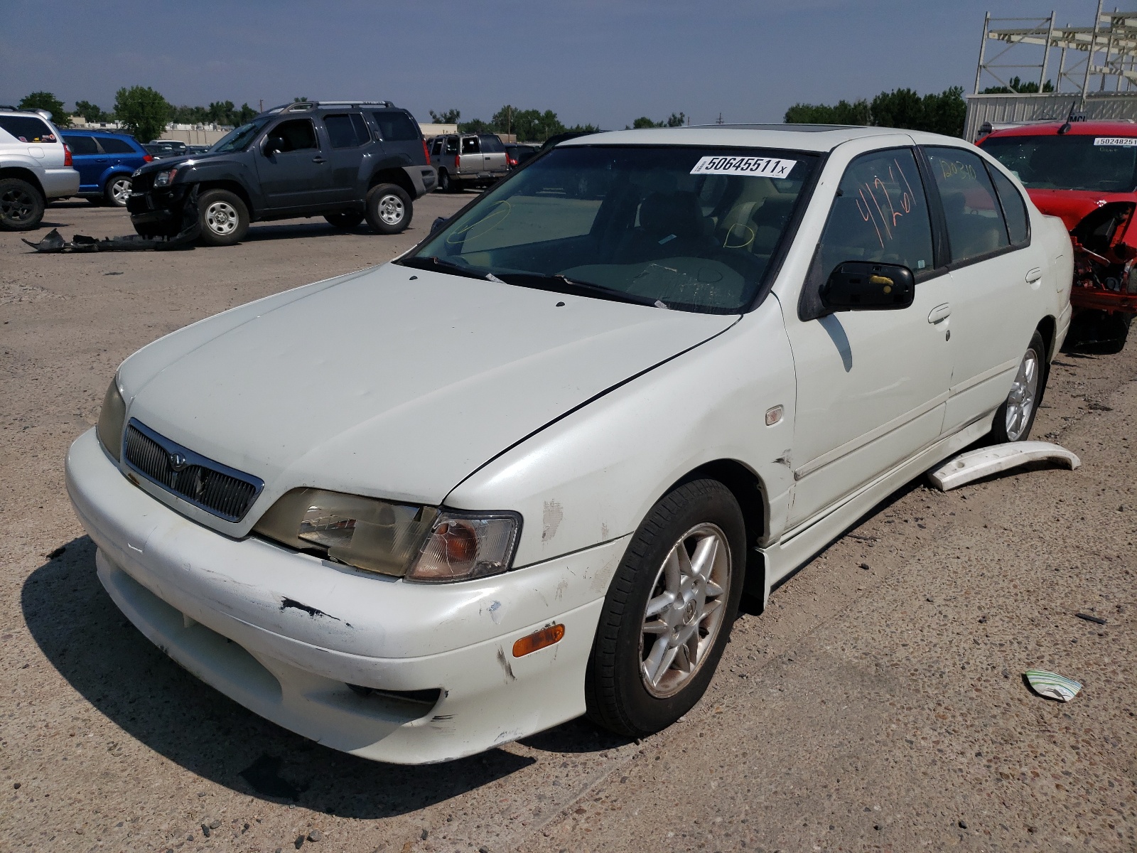 Photo 2 from auction – 2002 INFINITI G20 with VIN JNKCP11A42T504623