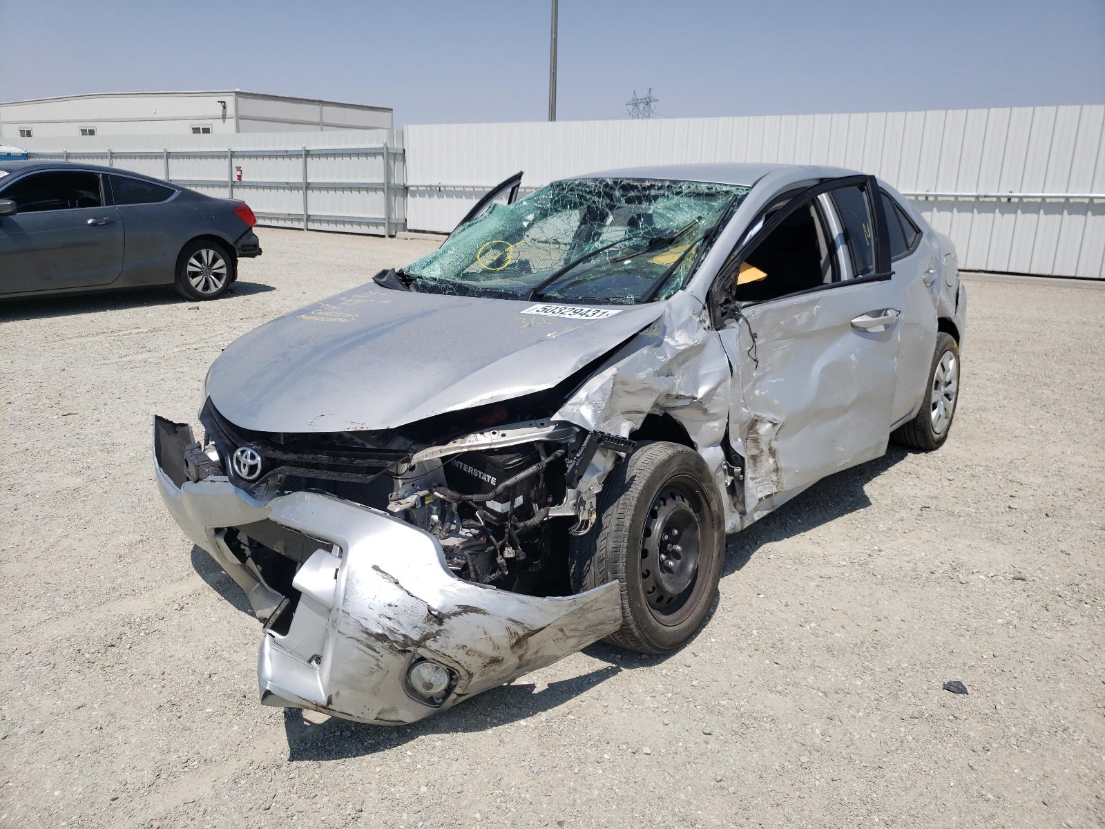 Photo 2 from auction – 2014 TOYOTA COROLLA L with VIN 5YFBURHEXEP129815