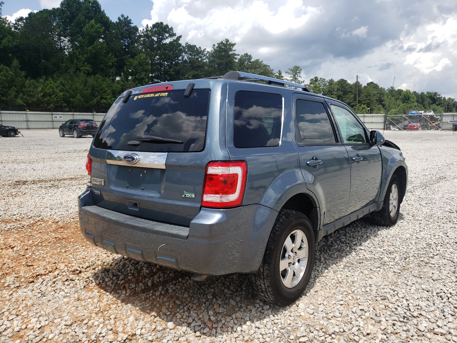 Photo 4 from auction – 2011 FORD ESCAPE LIM with VIN 1FMCU9EG3BKB35777