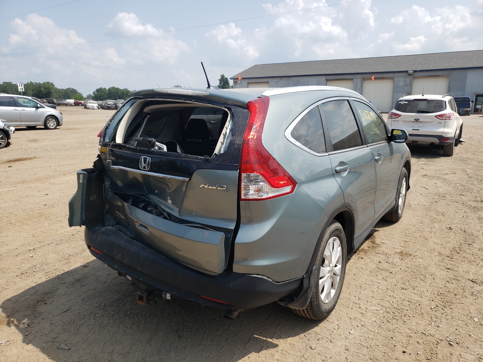 Photo 4 from auction – 2012 HONDA CR-V EXL with VIN 2HKRM4H70CH610086