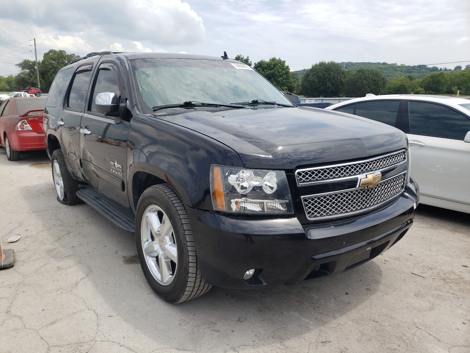 CHEVROLET TAHOE C150 2011 with VIN 1GNSCAE04BR229284 - Photo from auction
