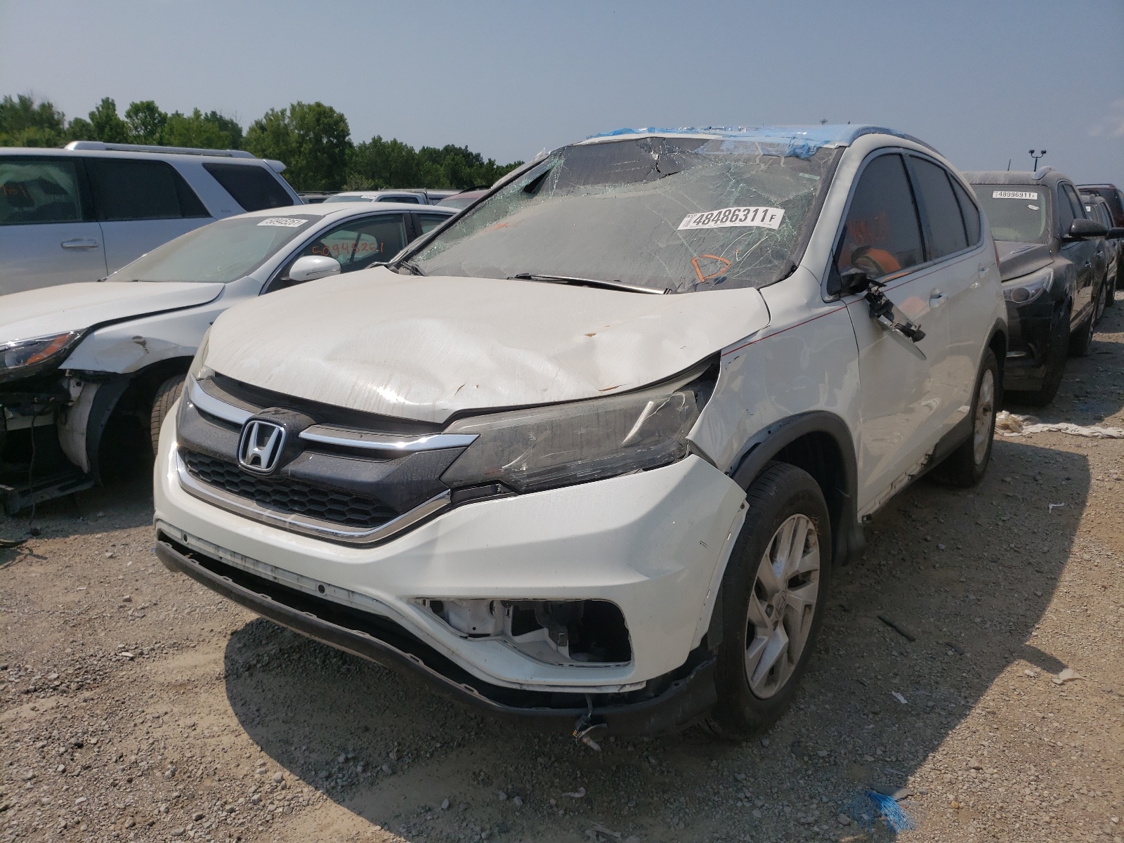 Photo 2 from auction – 2015 HONDA CR-V EXL with VIN 5J6RM4H75FL028804