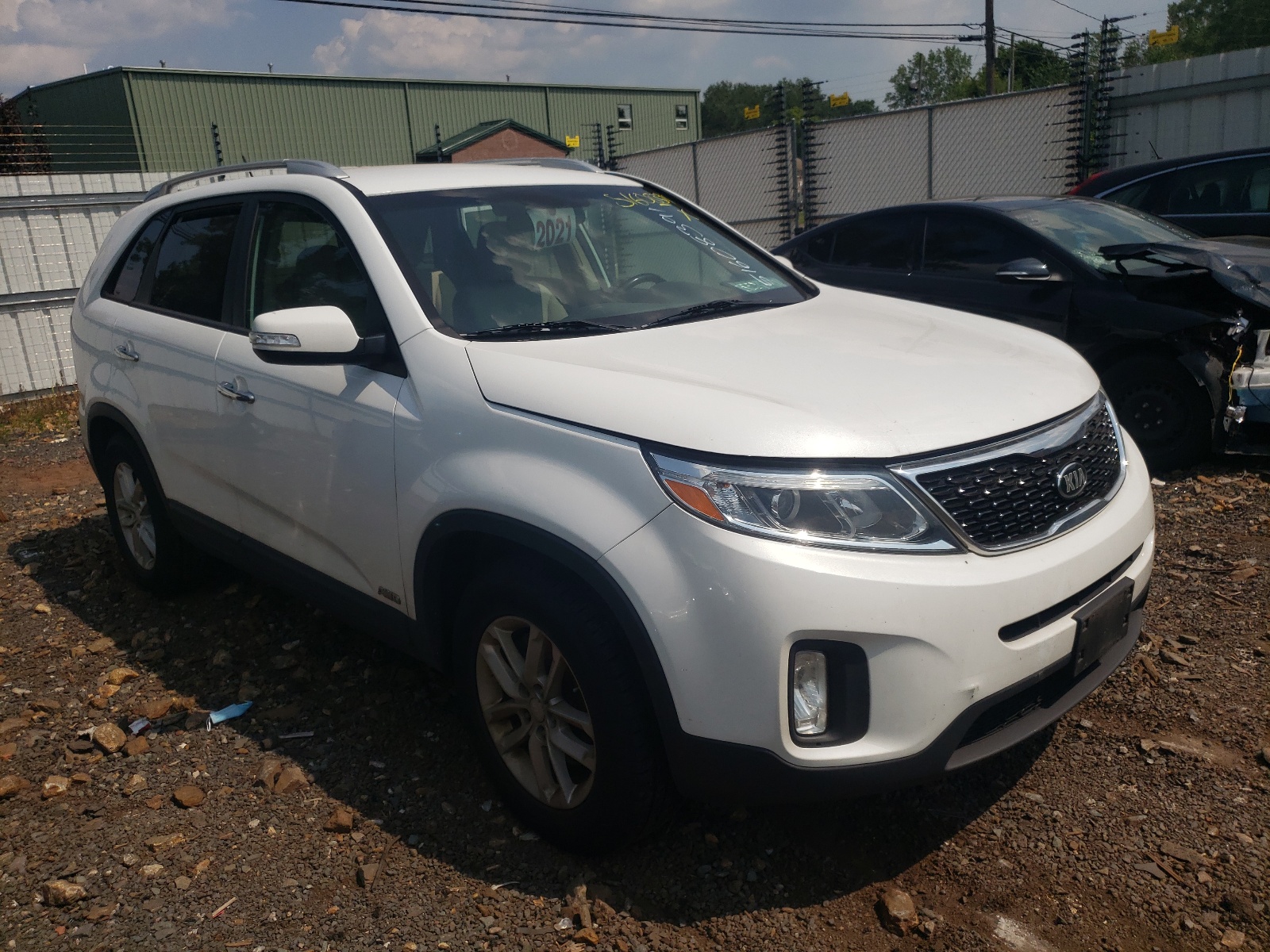 KIA SORENTO LX 2015 with VIN 5XYKTDA67FG656838 - Photo from auction