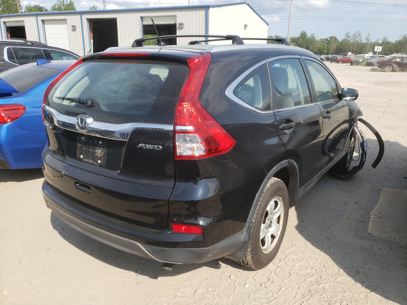 Photo 4 from auction – 2016 HONDA CR-V LX with VIN 5J6RM4H33GL087042